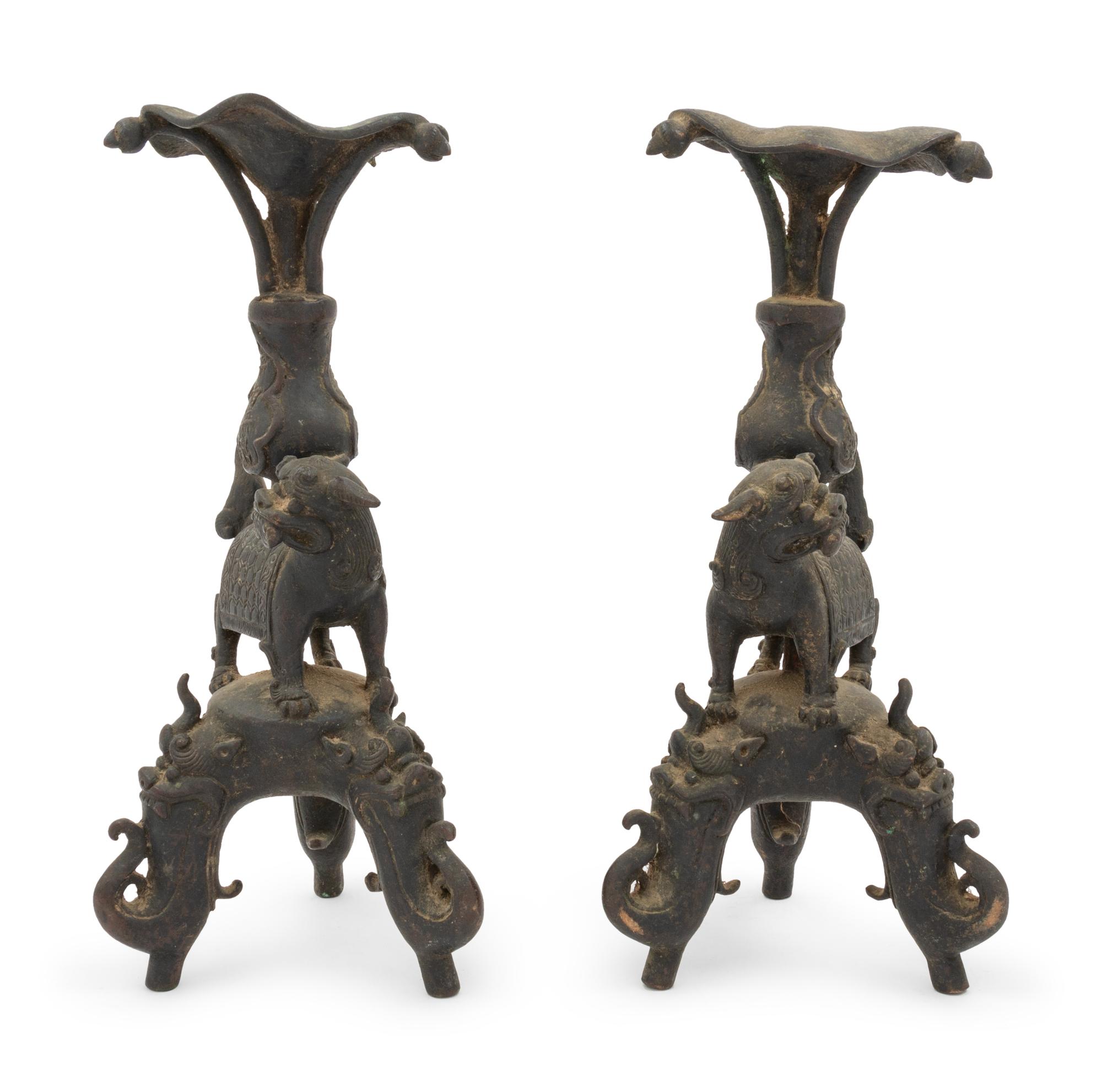 A Pair of Japanese Bronze Mythical Beast-Form Candle Holders