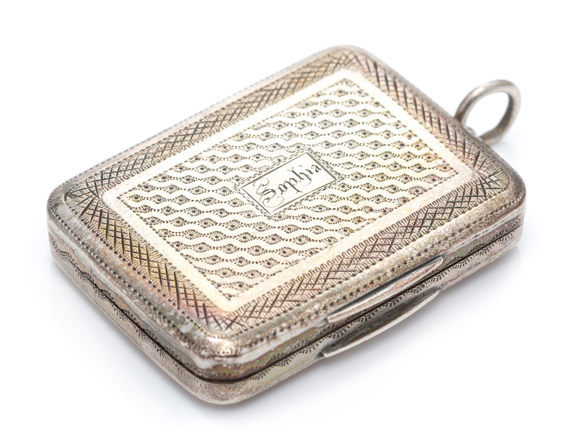A George III Silver Vinaigrette, Samuel Pemberton, Birmingham, 1786, having a geometric decorated lid centered by an engraved cartouche