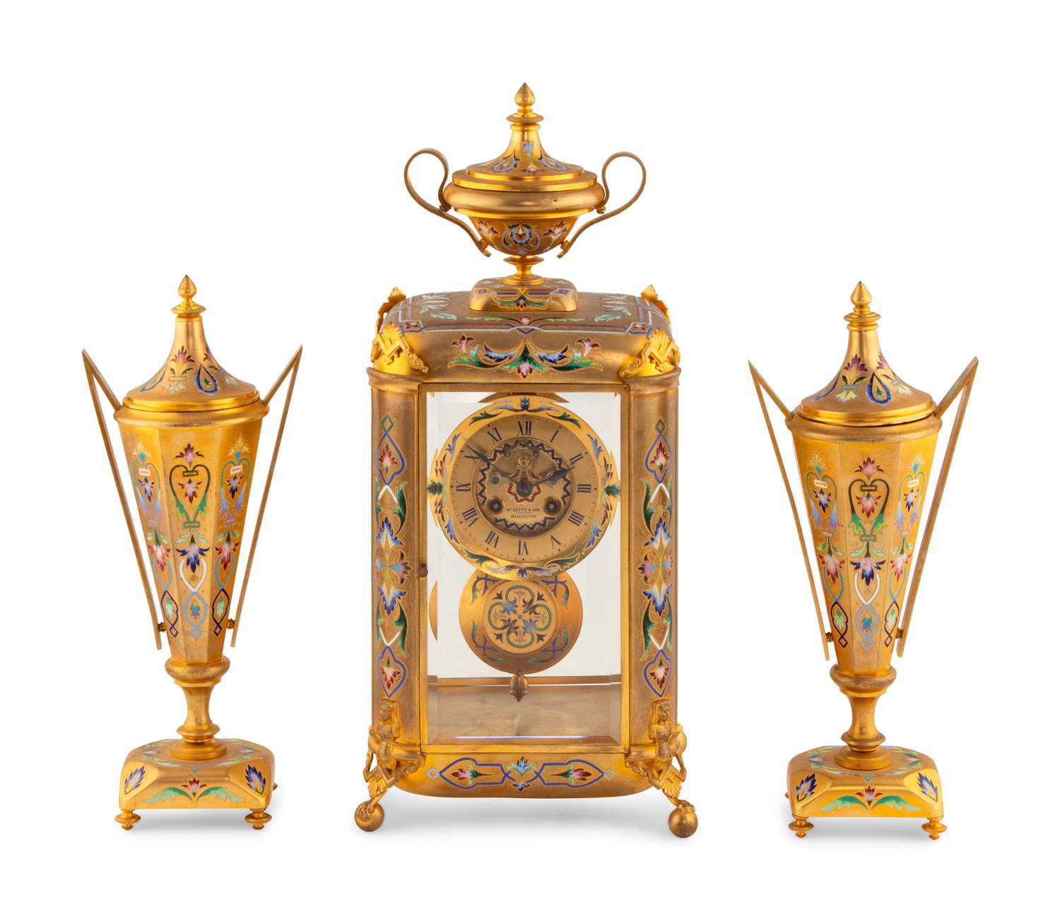 An English Champlevé Enamel and Gilt Bronze Clock Garniture