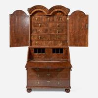A William & Mary walnut double dome secretary bureau circa 1710