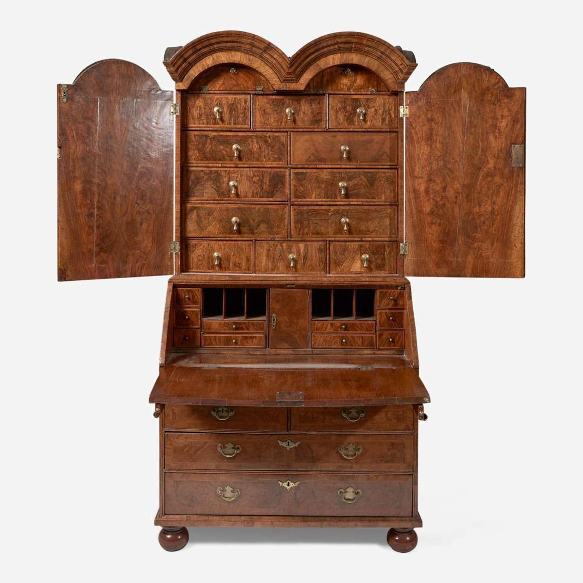 A William & Mary walnut double dome secretary bureau circa 1710