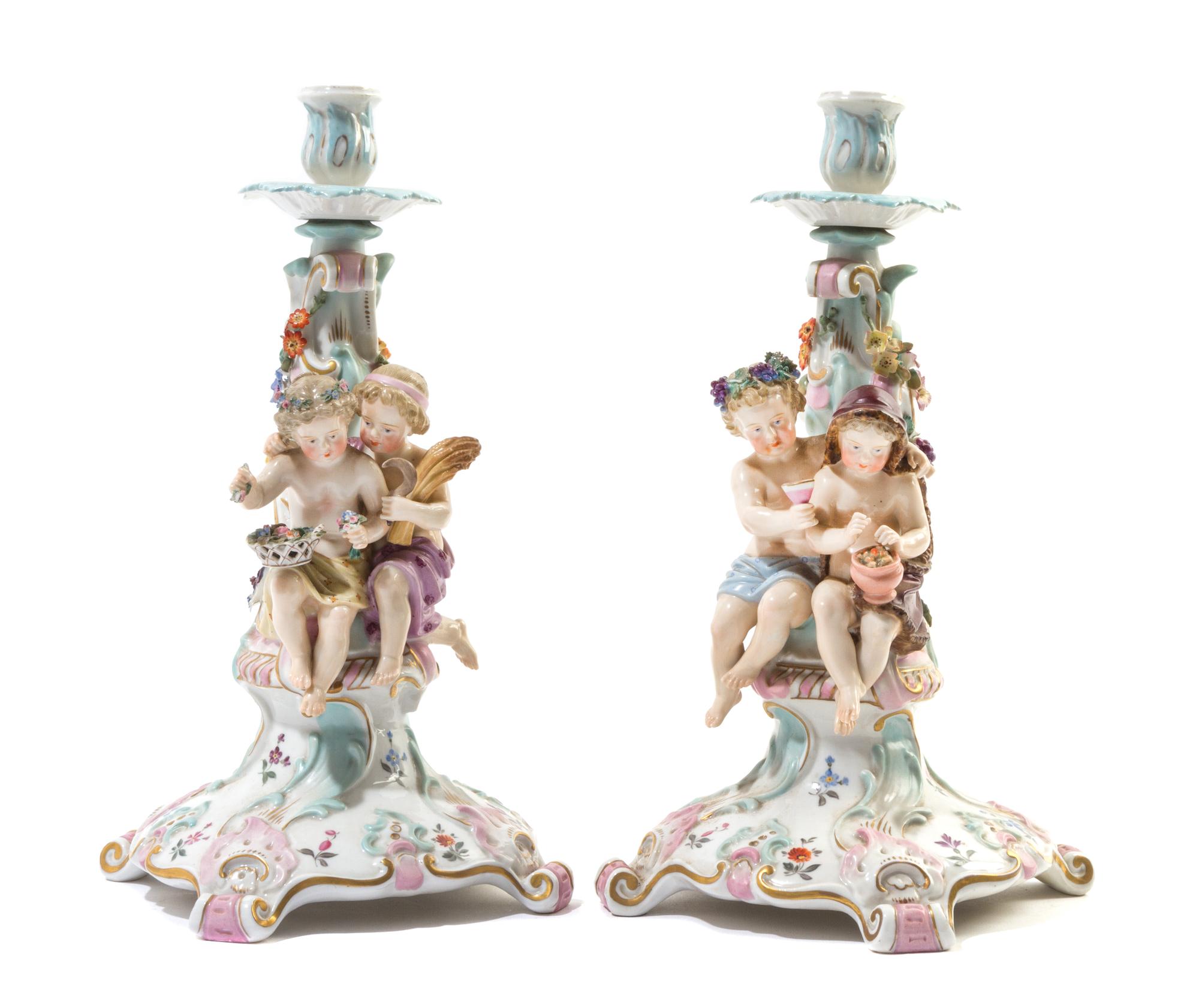 A Pair of Continental Porcelain Figural Candlesticks Height 12 1/2 inches. — ATTRIBUTED TO JOHANSON ROTH, 19TH CENTURY