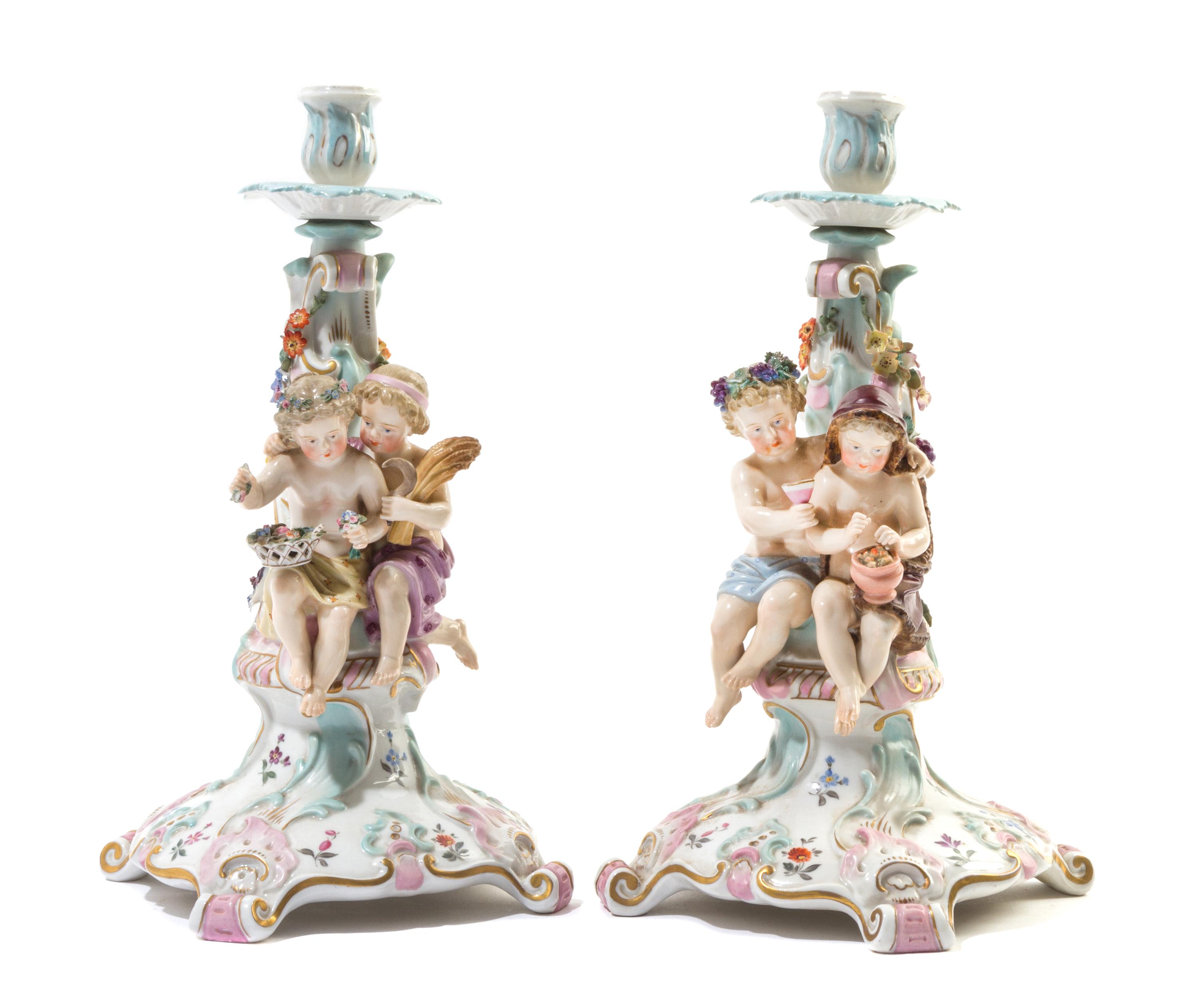 A Pair of Continental Porcelain Figural Candlesticks Height 12 1/2 inches. — ATTRIBUTED TO JOHANSON ROTH, 19TH CENTURY