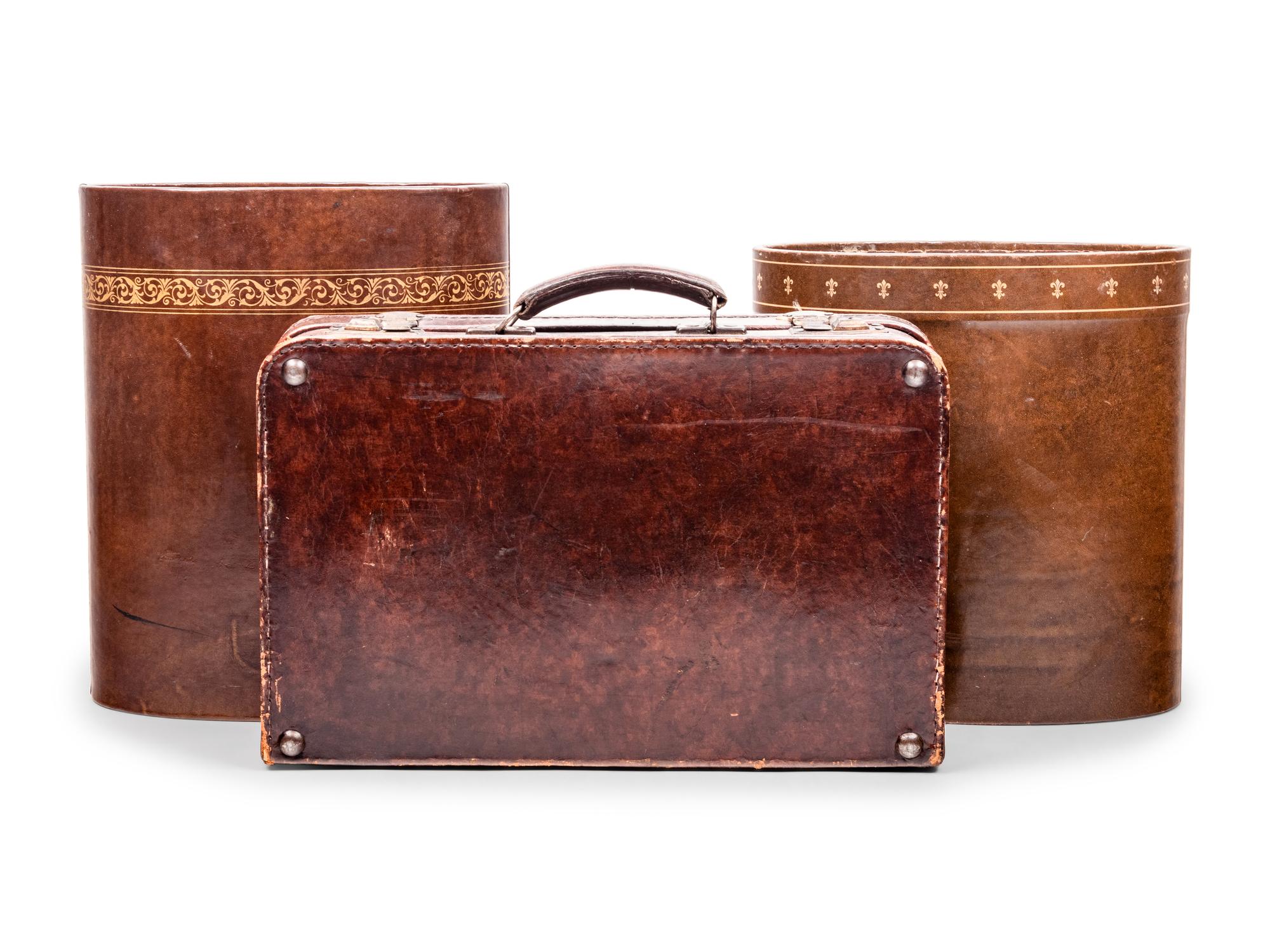 A Vintage Leather Case and Two Leather Wastebaskets