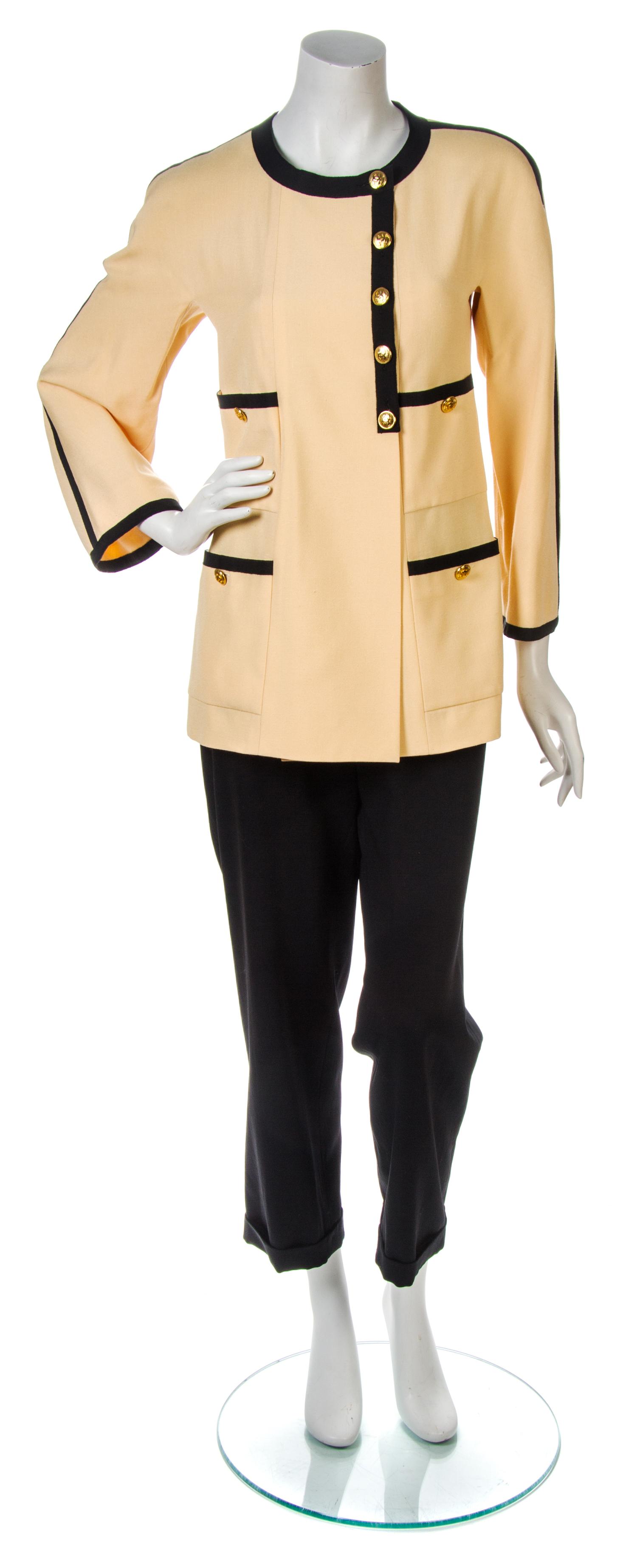 A Chanel Light Orange Jacket, Jacket size 38, pants size 44.