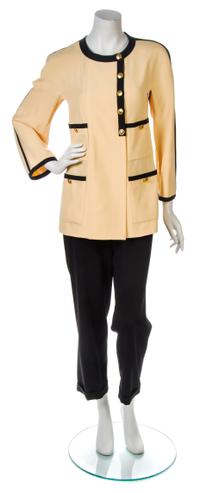 A Chanel Light Orange Jacket, Jacket size 38, pants size 44.