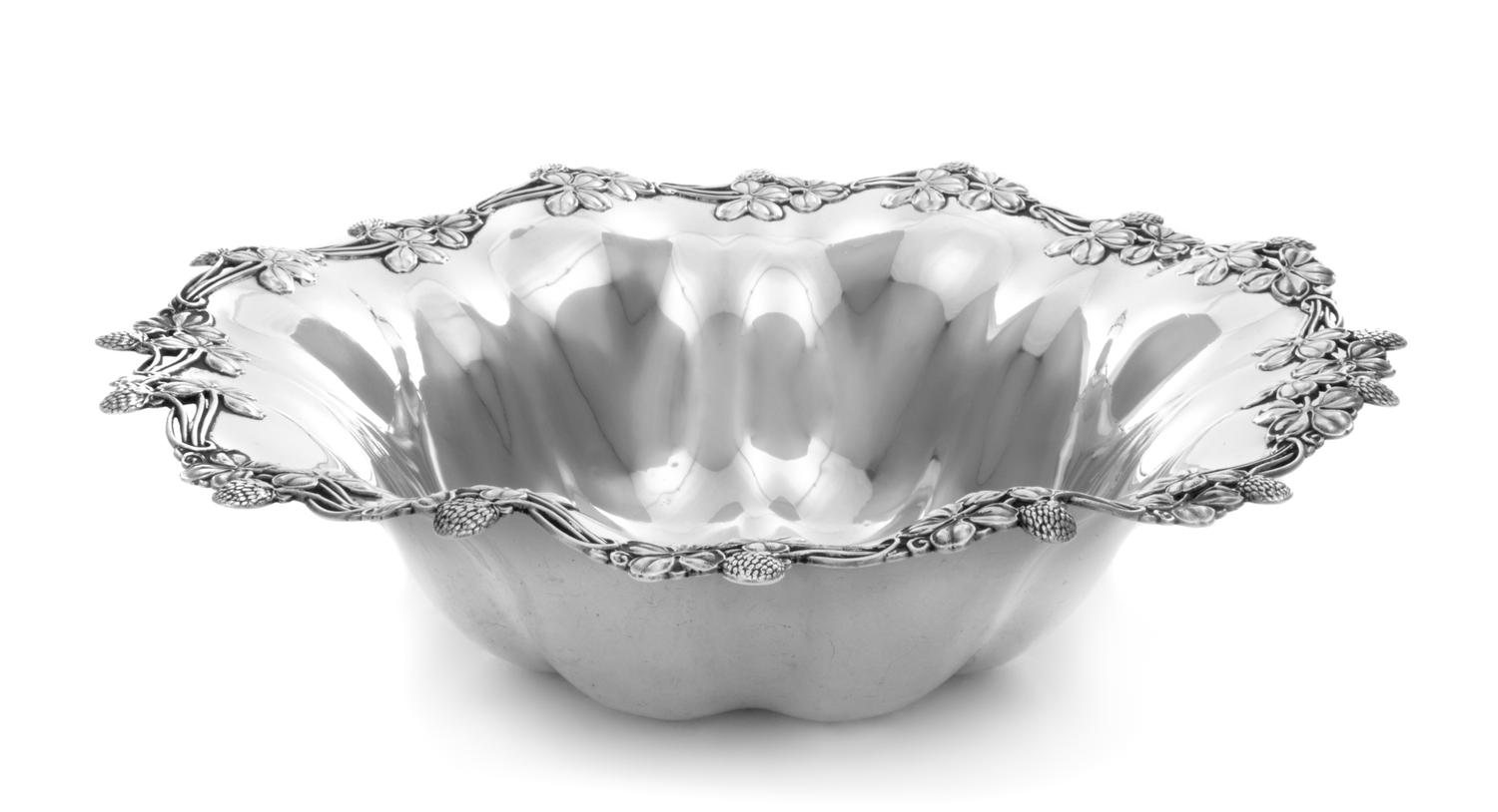 An American Silver Center Bowl, Shreve & Co., San Francisco, CA, having a shamrock decorated border and a lobed body.