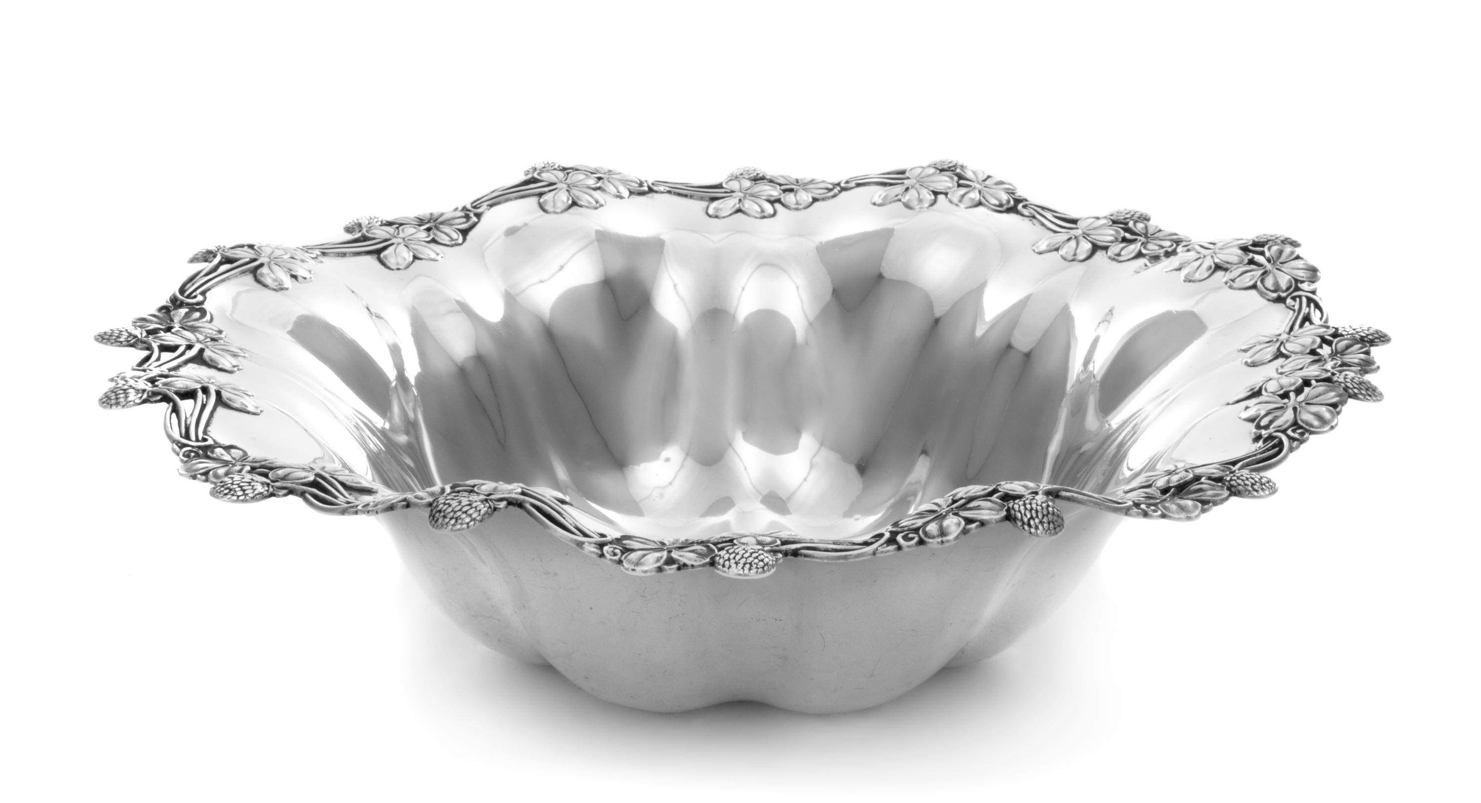An American Silver Center Bowl, Shreve & Co., San Francisco, CA, having a shamrock decorated border and a lobed body.