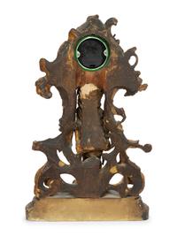 A Continental Carved, Painted and Parcel-Gilt Figural Clock