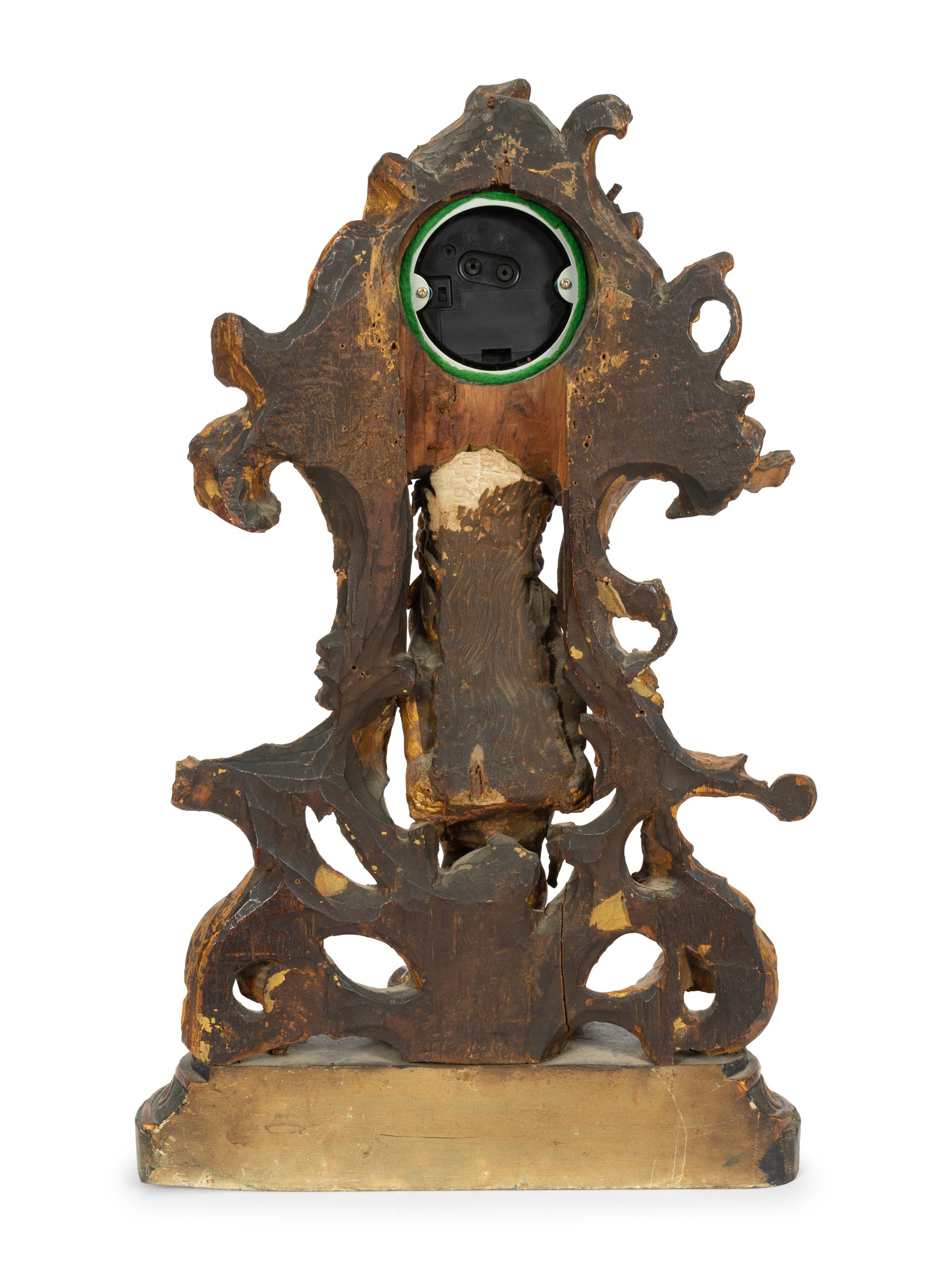 A Continental Carved, Painted and Parcel-Gilt Figural Clock