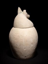 A Set of Four Egyptian Painted Limestone Canopic Jars of the Sons of Horus