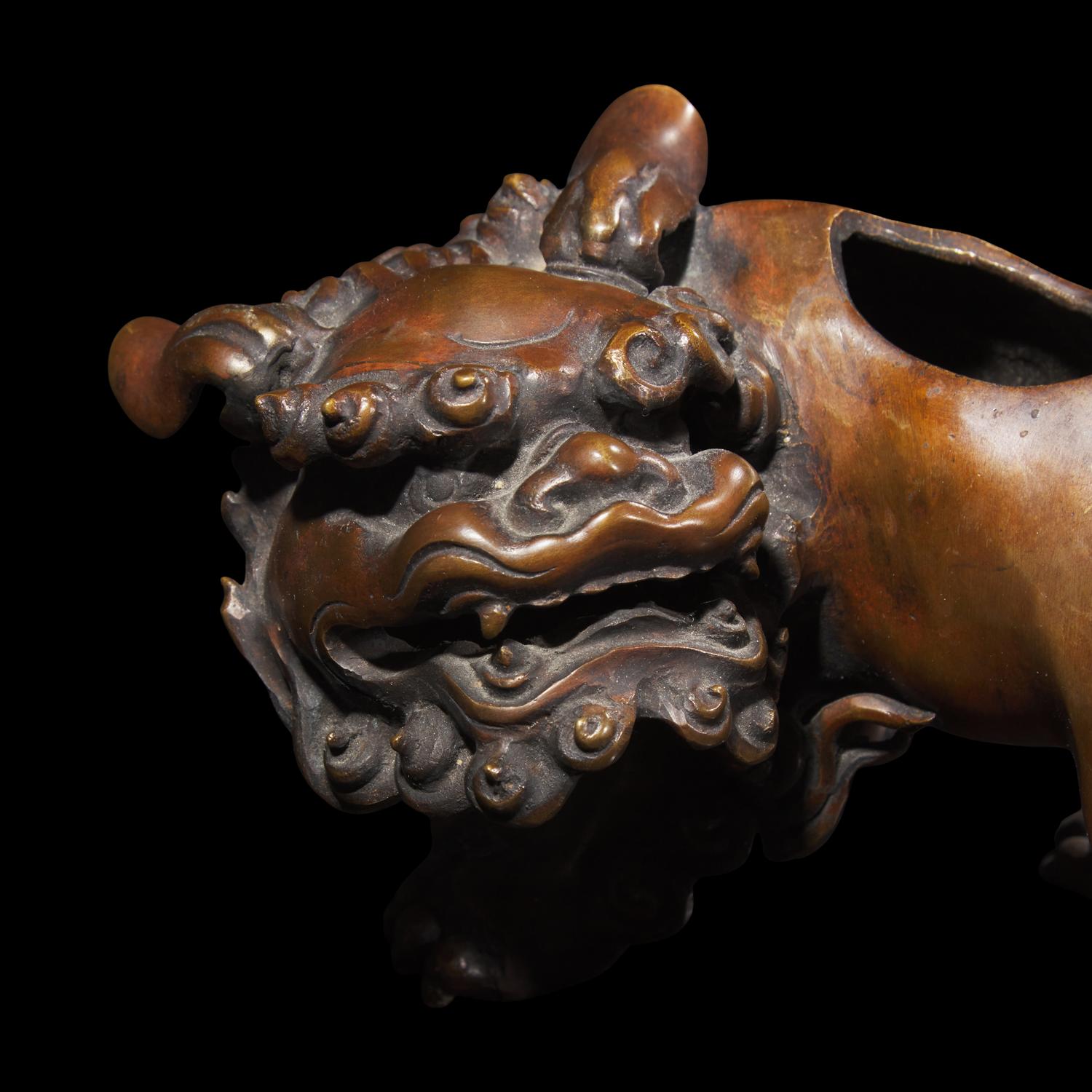 A Patinated Bronze Daoist Immortal Incense Burner, Late 19th Century 19世紀末 仙人乘獅銅香薰