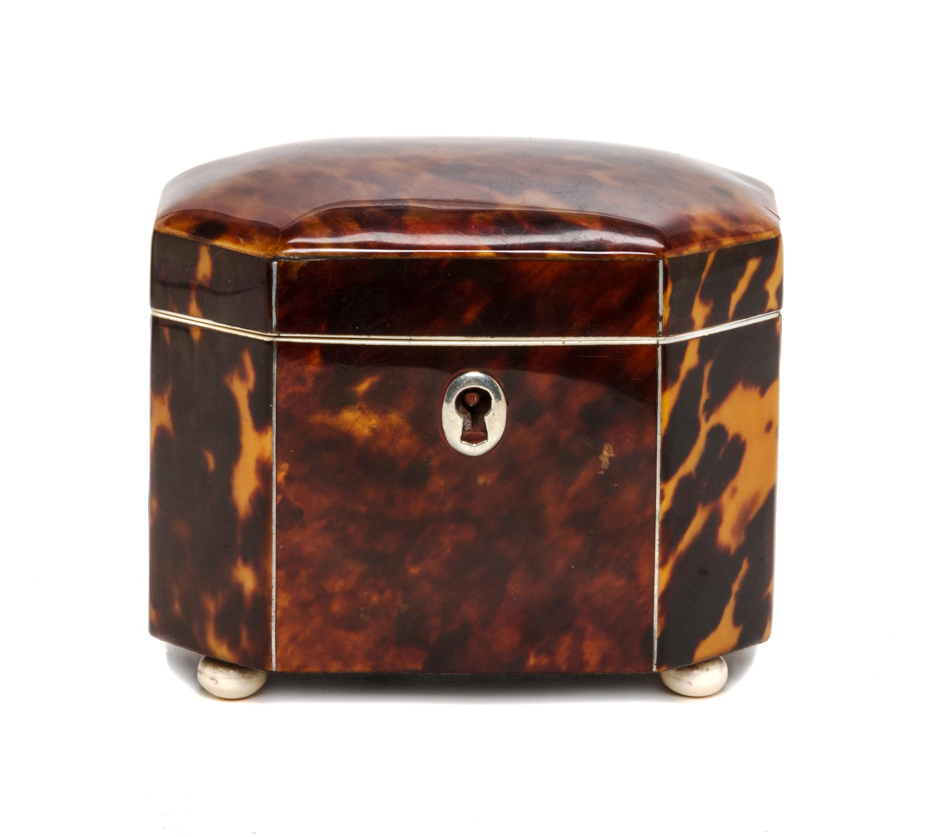 An English Tortoise Shell Tea Caddy, Height 3 1/2 x width 4 x depth 2 3/4 inches.
