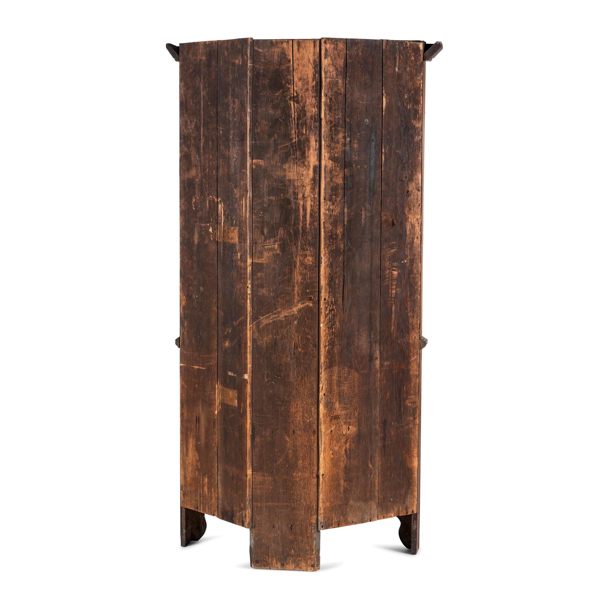 A Chippendale Paneled Cherrywood Corner Cupboard
