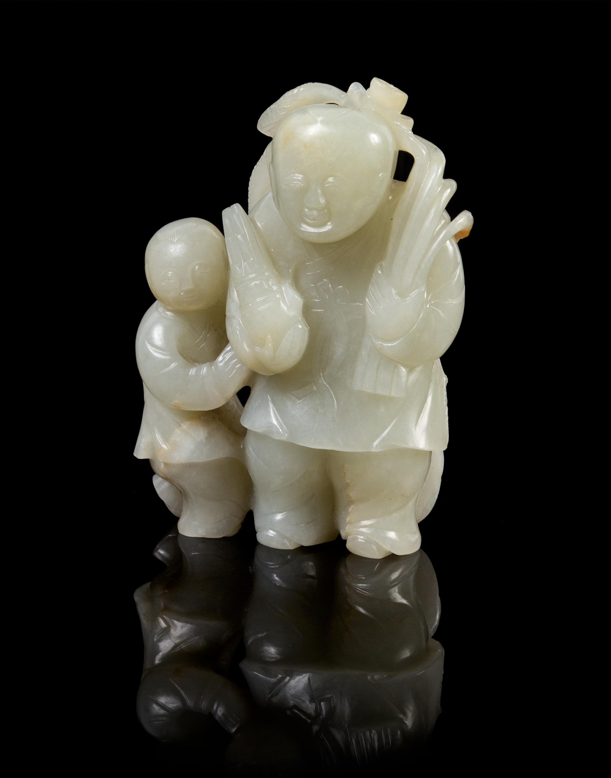 A Chinese Carved Jade Group 16TH/17TH CENTURY Height 3 1/2 x width 2 1/2 inches. — 16TH/17TH CENTURY