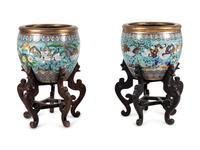A Pair of Chinese Cloisonné Urns on Wood Stands