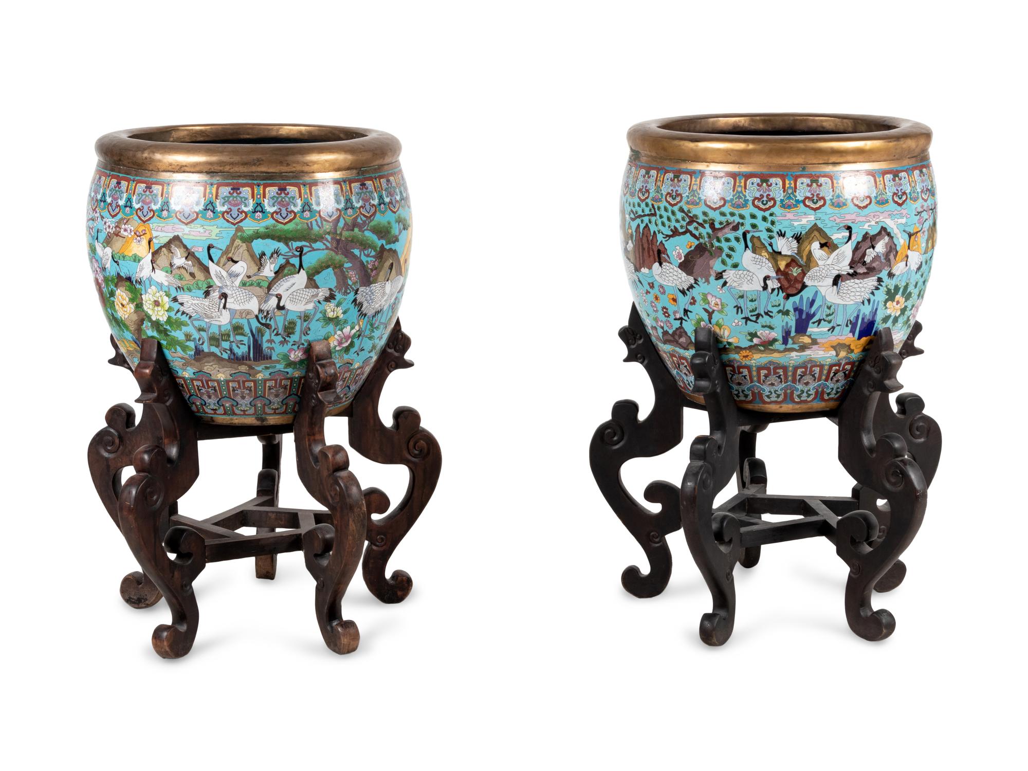 A Pair of Chinese Cloisonné Urns on Wood Stands