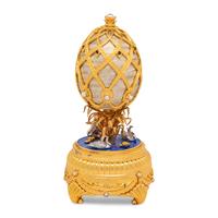 A Silver, Gilt and Enamel Decorated Swan Lake Egg-Form Music Box