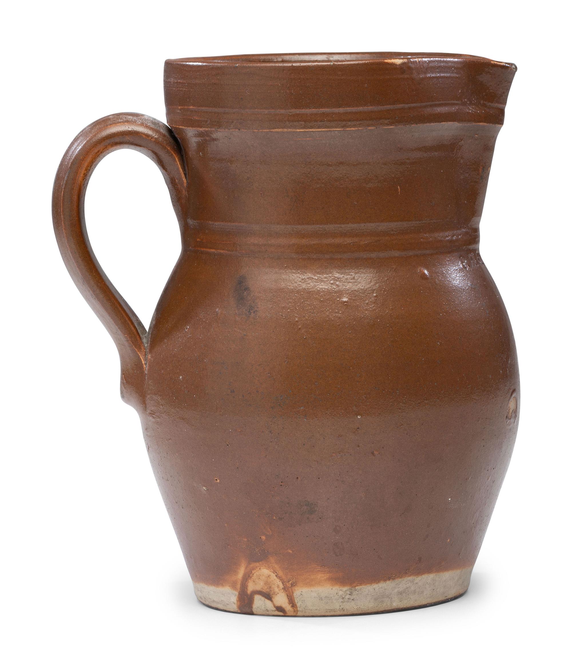A P.H. Smith Albany Slip Stoneware Pitcher
