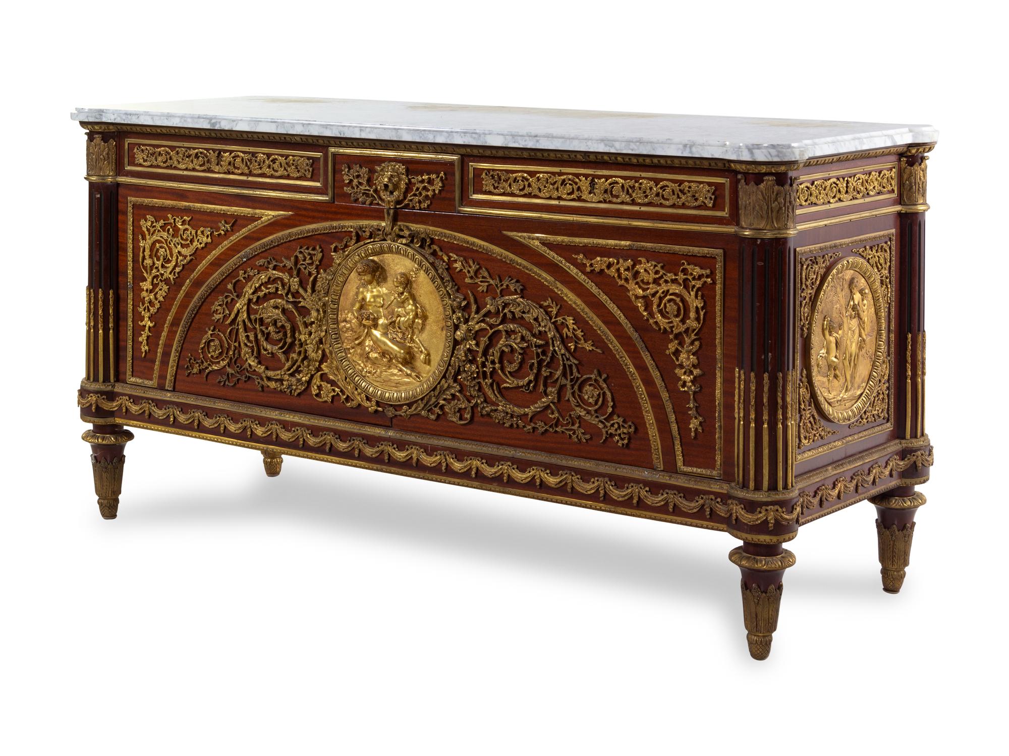 A Louis XVI Style Gilt Bronze Mounted Mahogany Commode a Vantaux