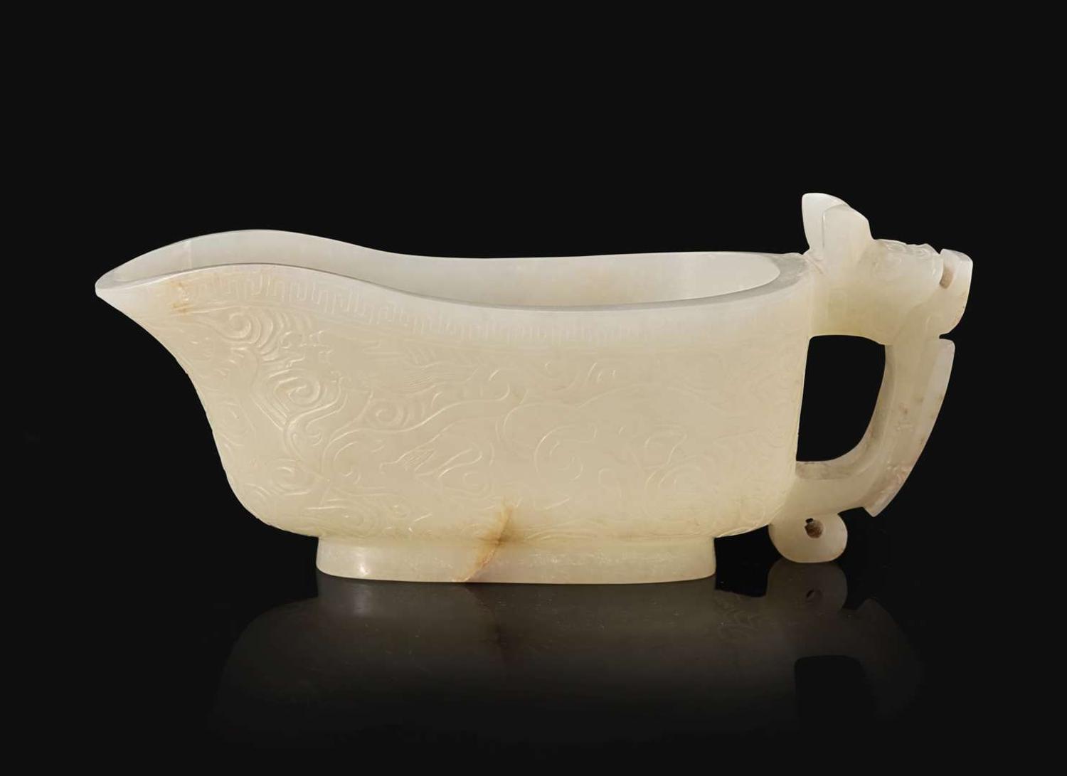 A Chinese carved white jade "Yi" water coupe, 18th/early 19th century or earlier 白玉水匜 十八至十九世紀或更早