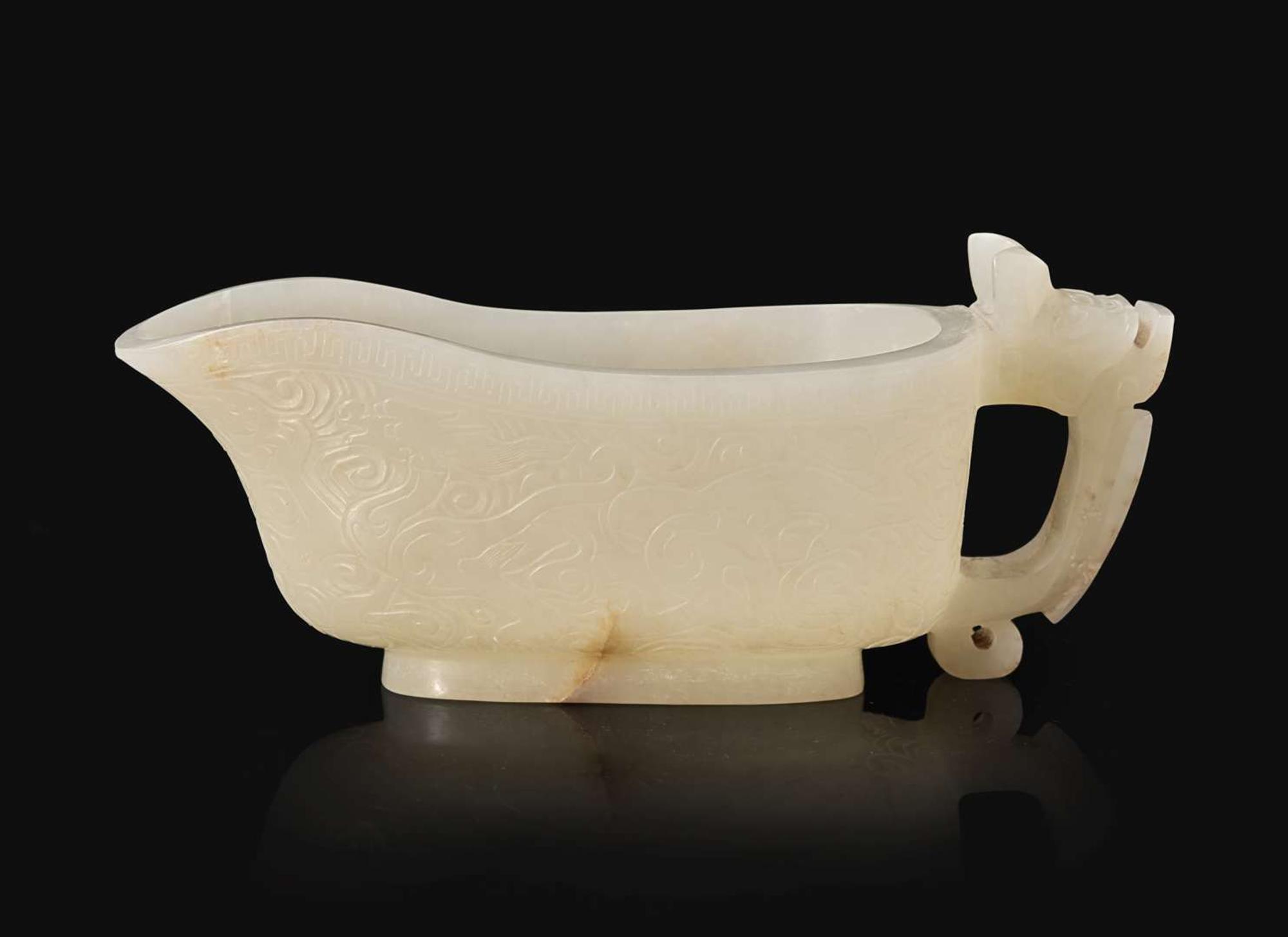 A Chinese carved white jade "Yi" water coupe, 18th/early 19th century or earlier 白玉水匜 十八至十九世紀或更早