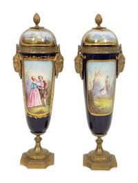 A Pair of Gilt Bronze Mounted Sevres Style Porcelain Urns