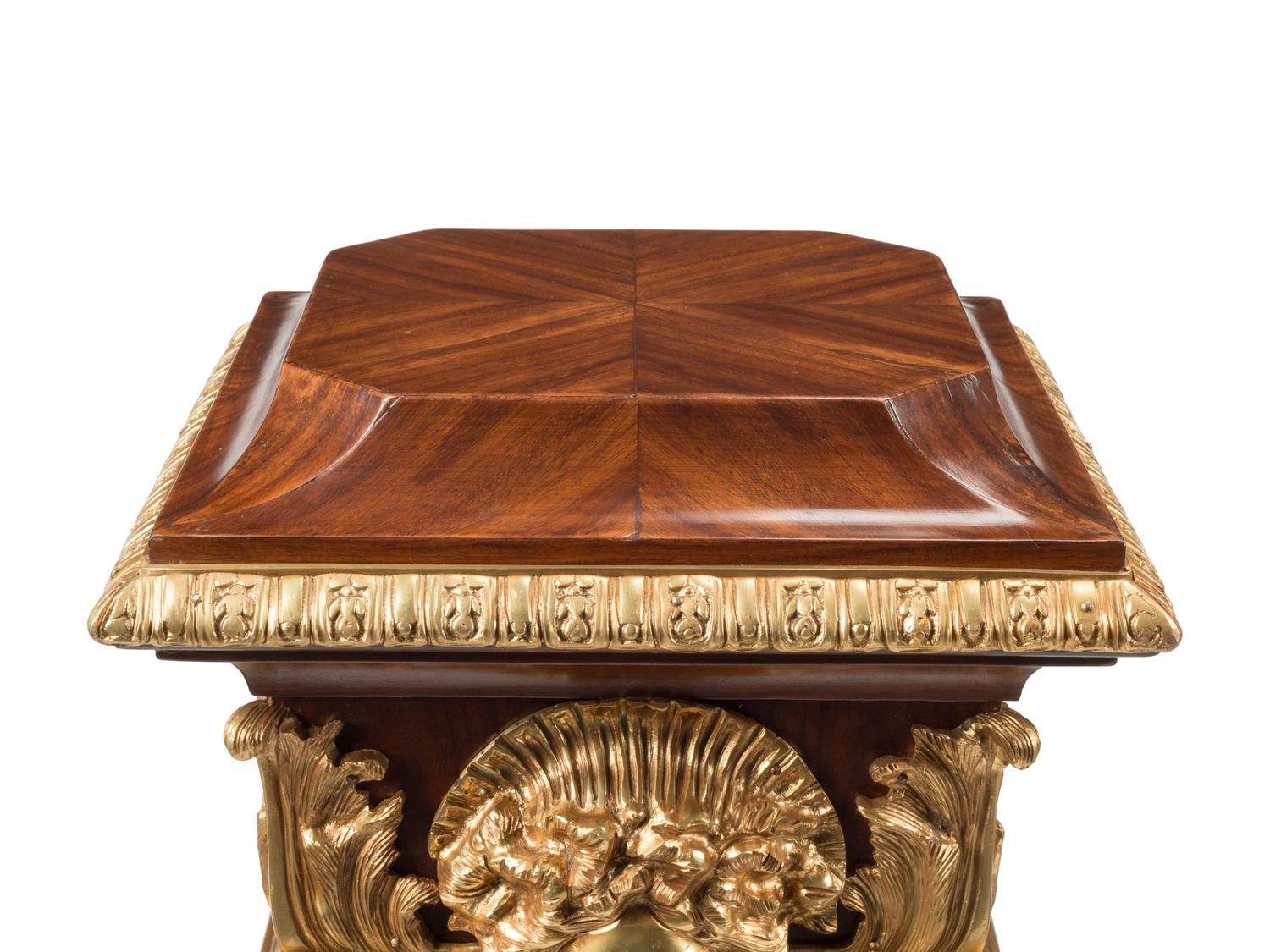 A Pair of Régence Style Gilt Bronze Mounted Bookmatch-Veneered Pedestals