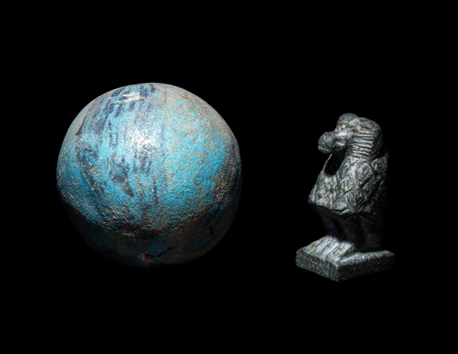 An Egyptian Steatite Baboon and a Bichrome Faience Ball Bead
