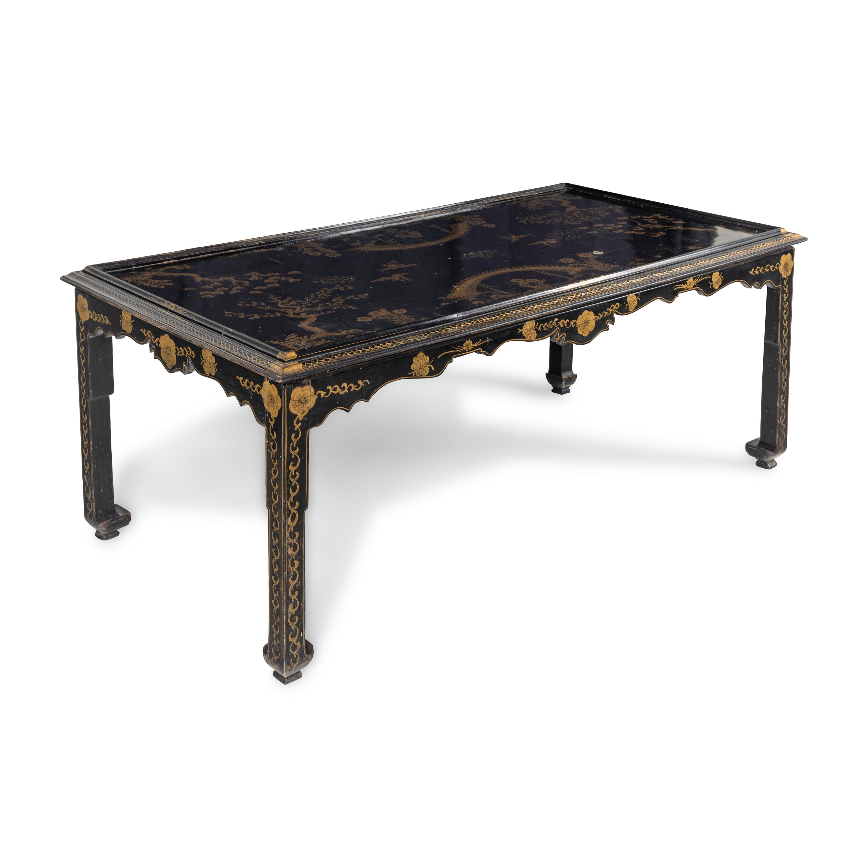 A Modern Parcel Gilt and Black Lacquered Chinoiserie Decorated Scroll Foot Table