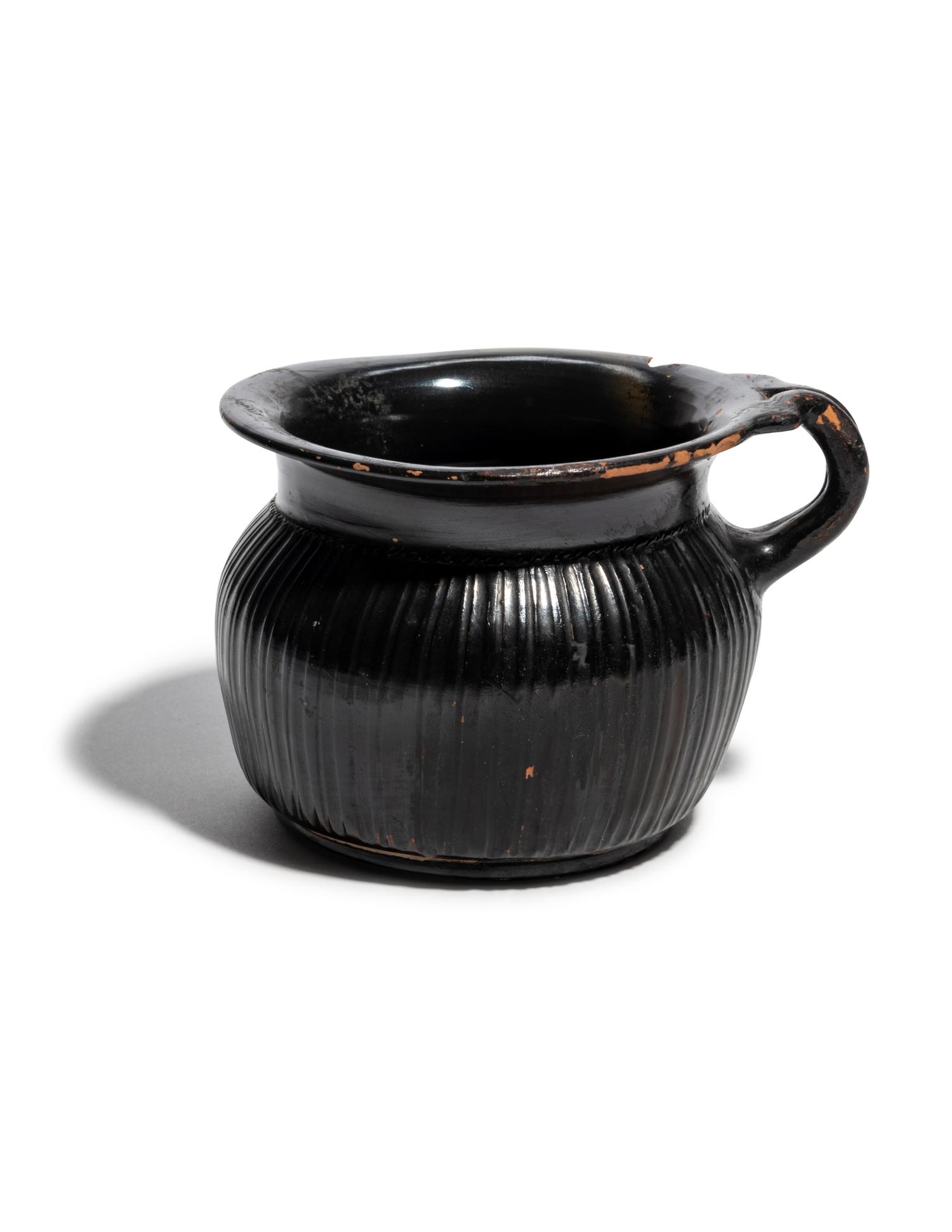 A Greek Black-Glazed Ribbed Mug