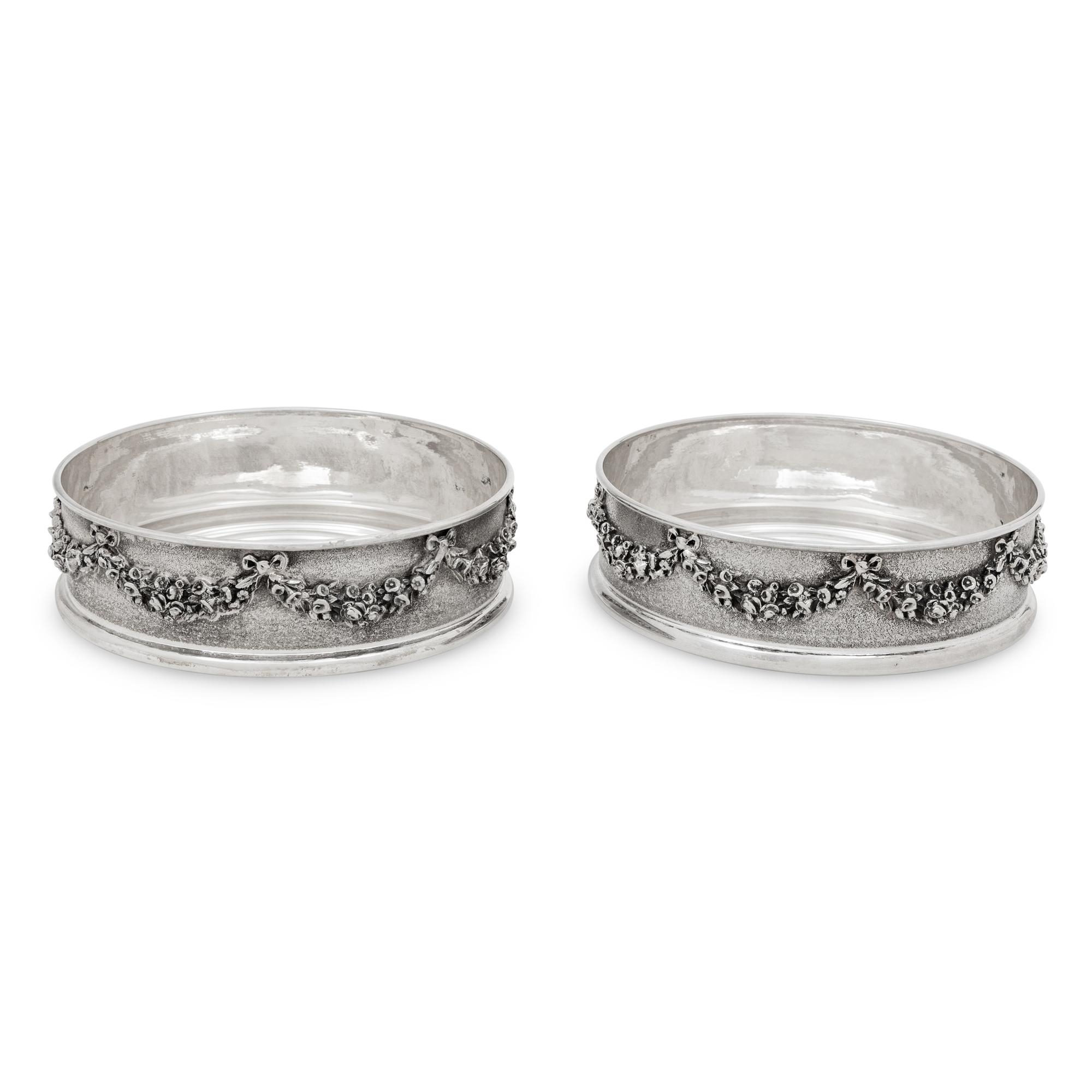 A Pair of Greek Silver Bottle Coasters
