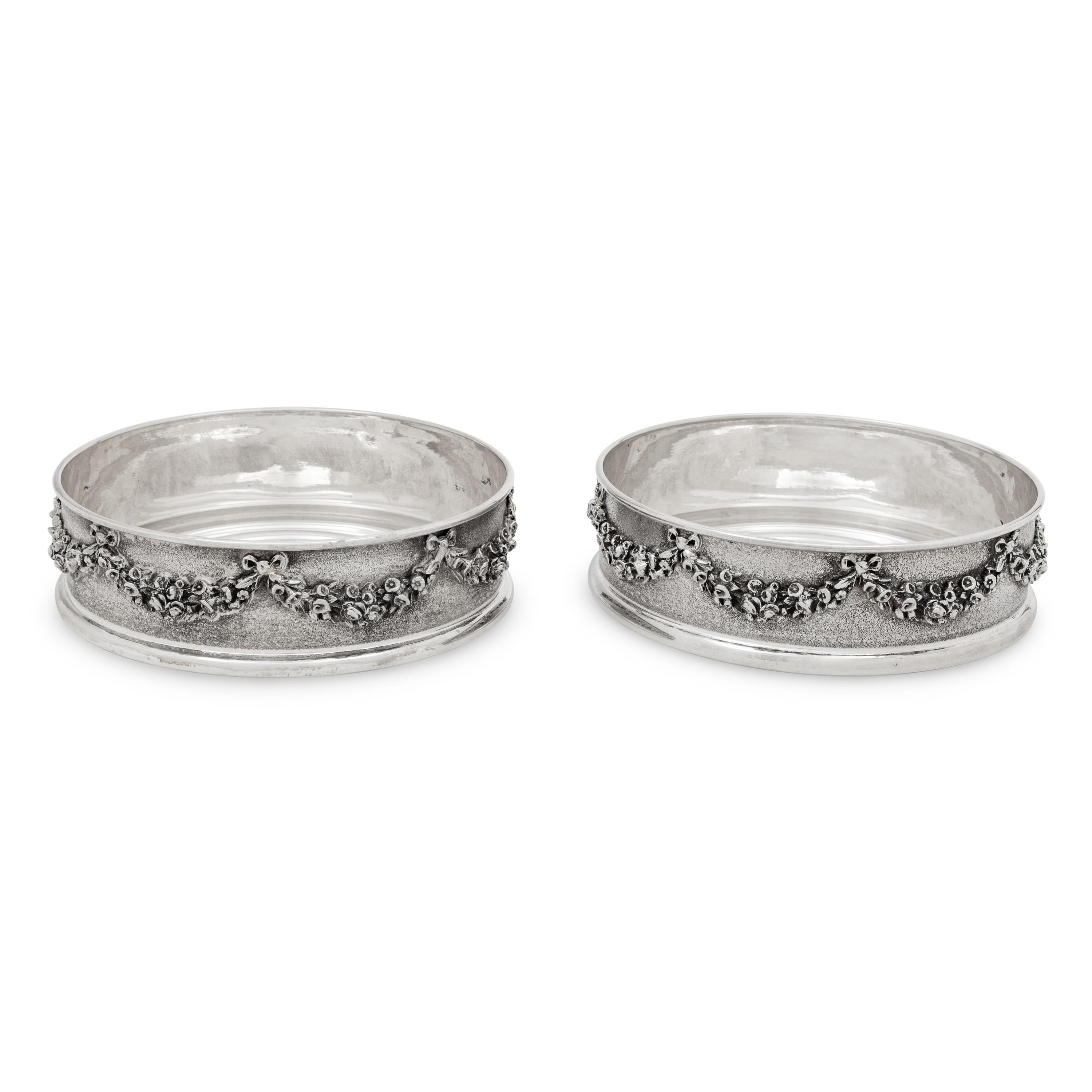 A Pair of Greek Silver Bottle Coasters