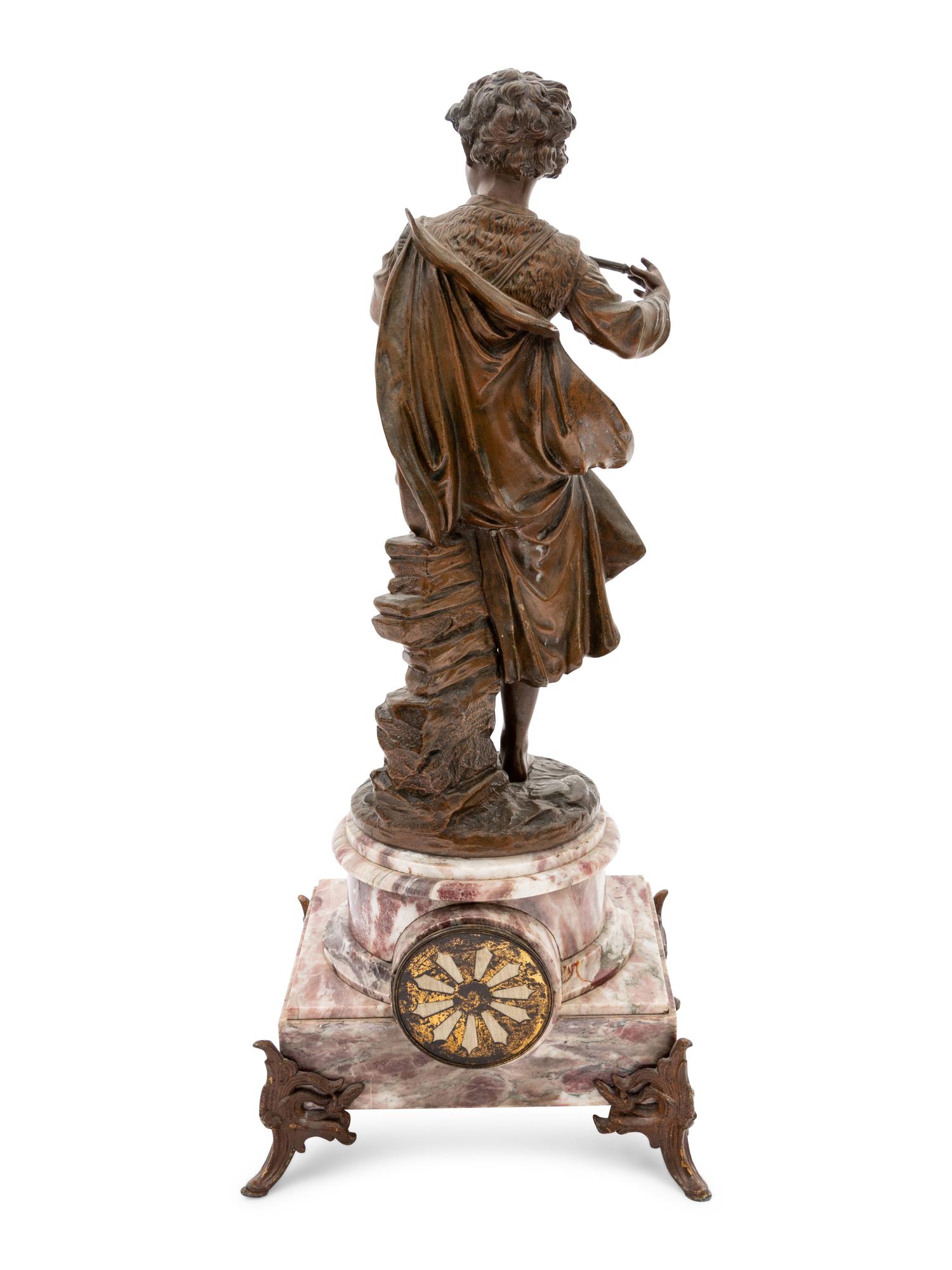 A Continental Bronze and Marble Figural Clock