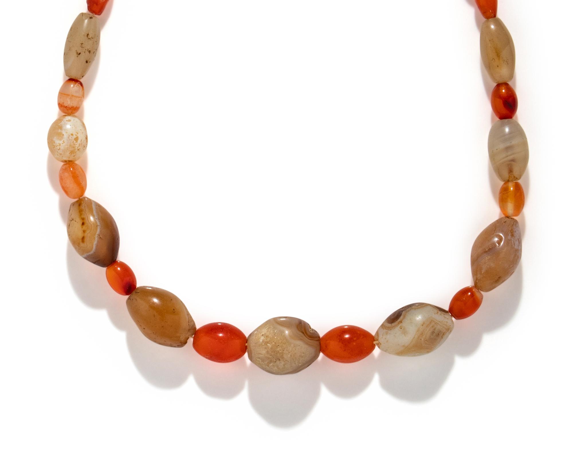 A Western Asiatic Banded Agate and Carnelian Bead Necklace