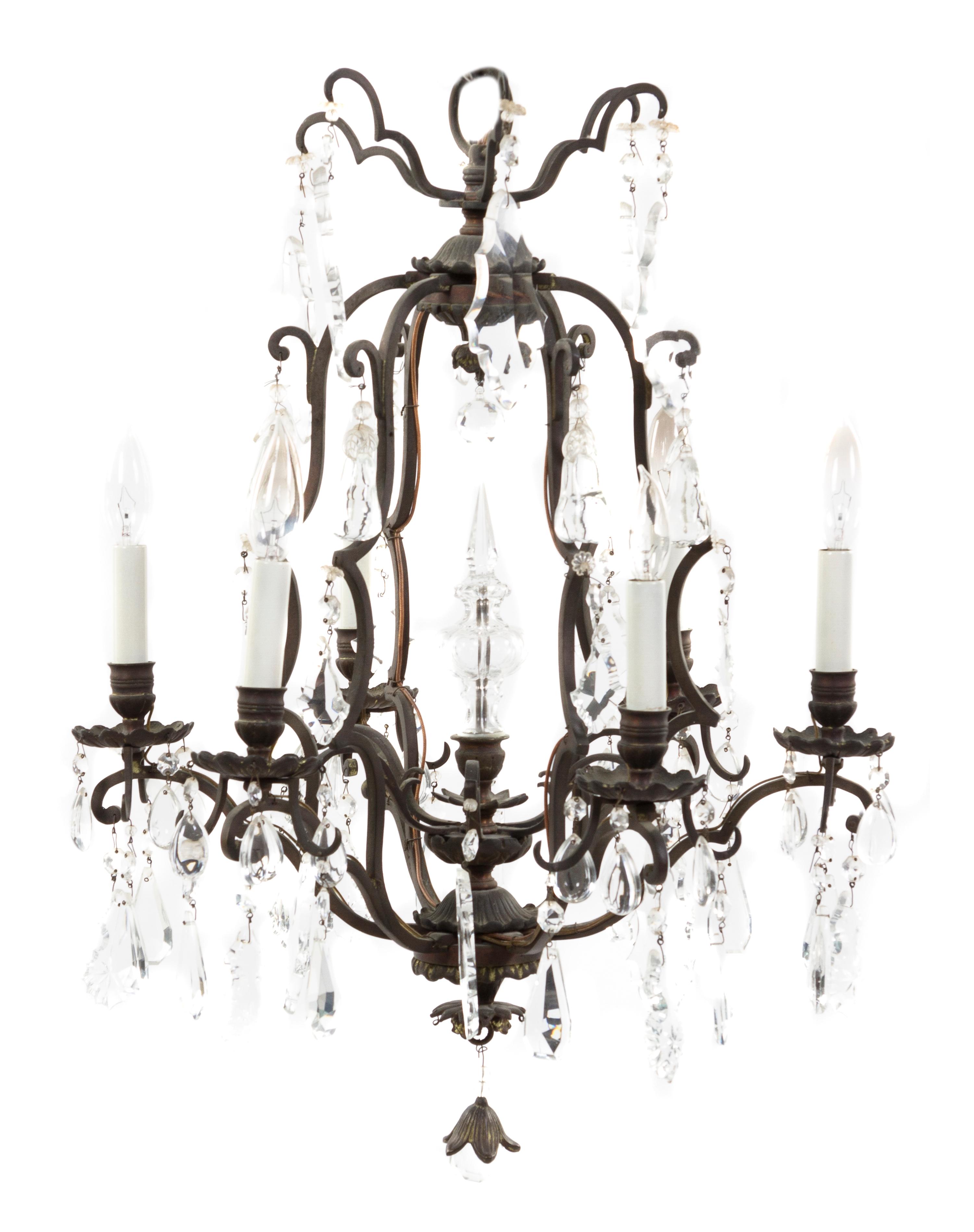 A French Wrought Iron Six-Light Chandelier, Height 27 x diameter 19 1/2 inches.