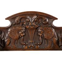 A Pair of Italian Carved Walnut Savonarola Chairs