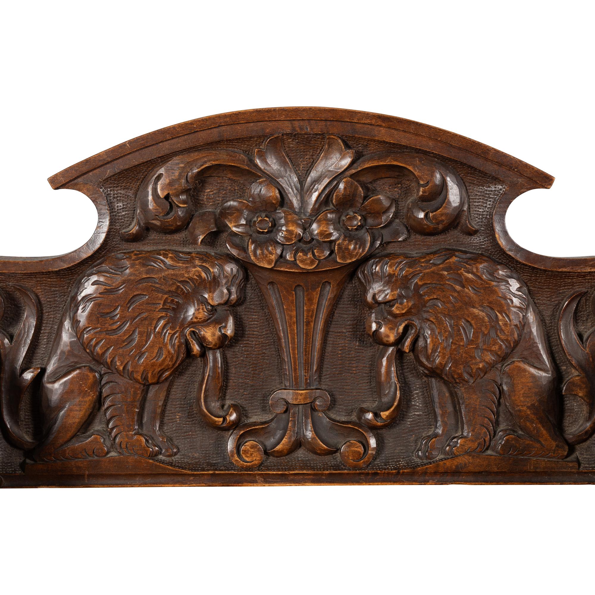A Pair of Italian Carved Walnut Savonarola Chairs