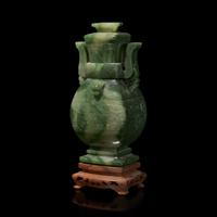 A Chinese Spinach Jade Archaistic Vase and Cover 碧玉雕饕餮紋仿古蓋瓶 帶木座
