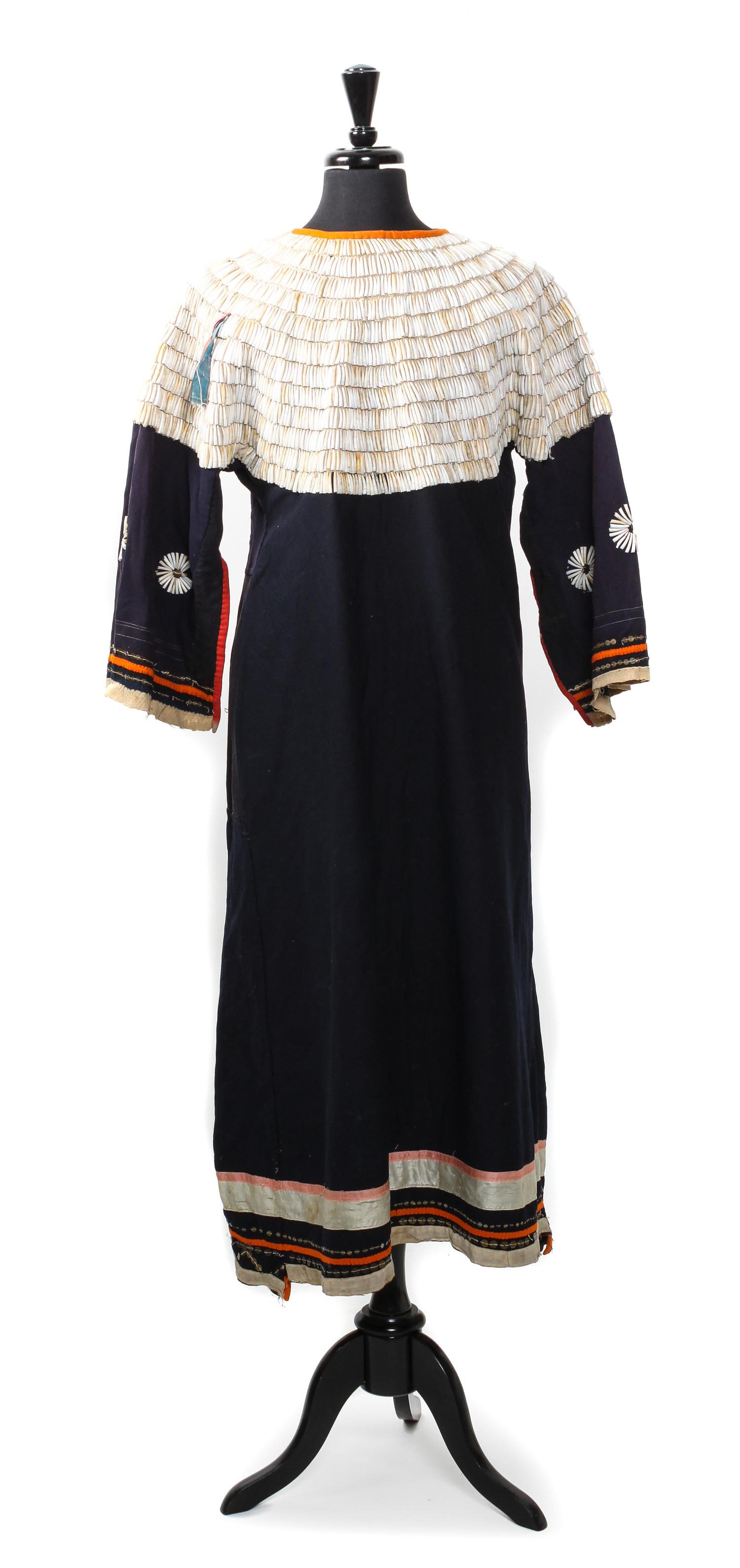 A Cloth and Dentalium Shell Sioux Dress Length approximately 49 x width 17 inches.