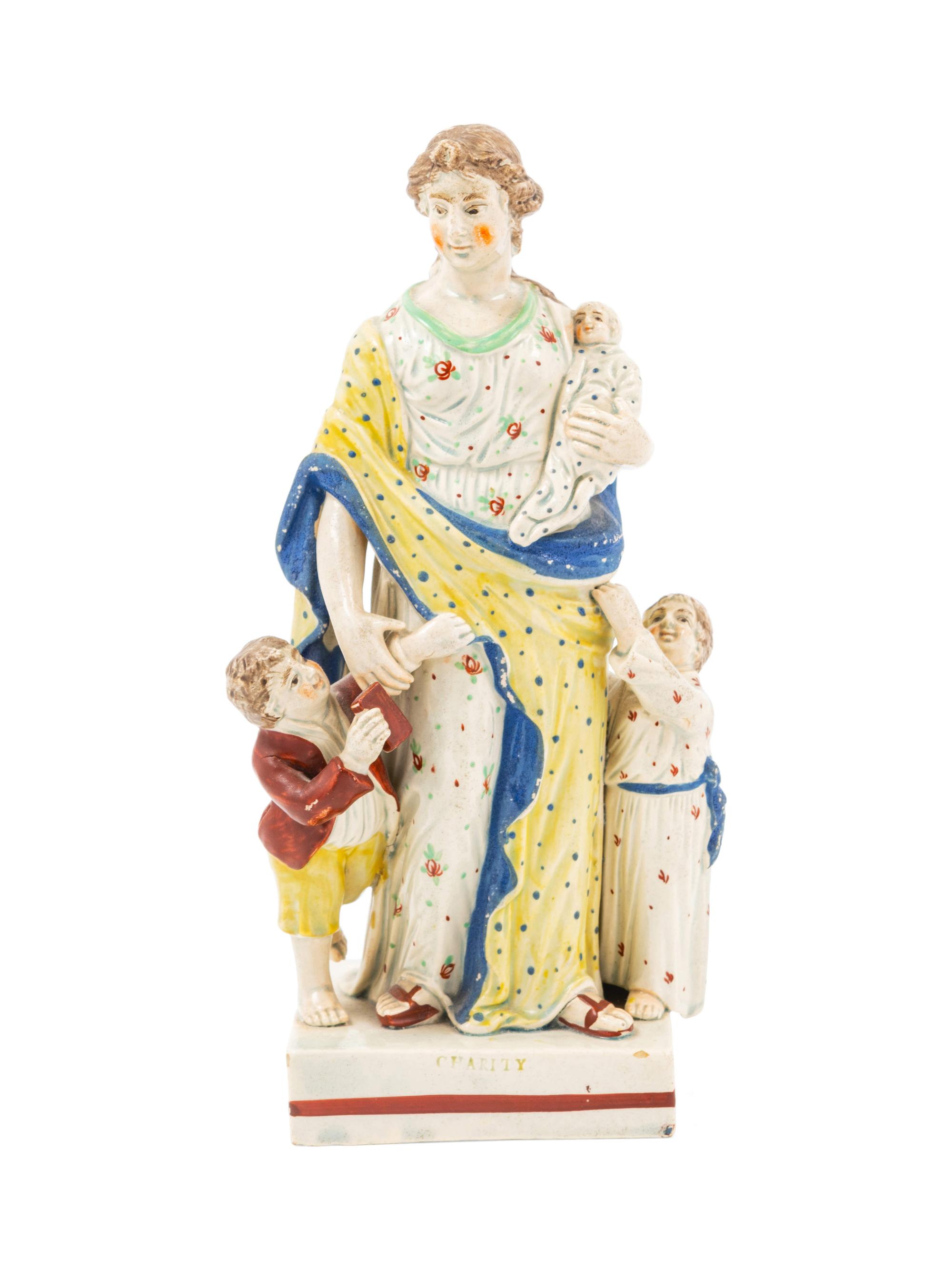 A Staffordshire Pottery Figure of Charity