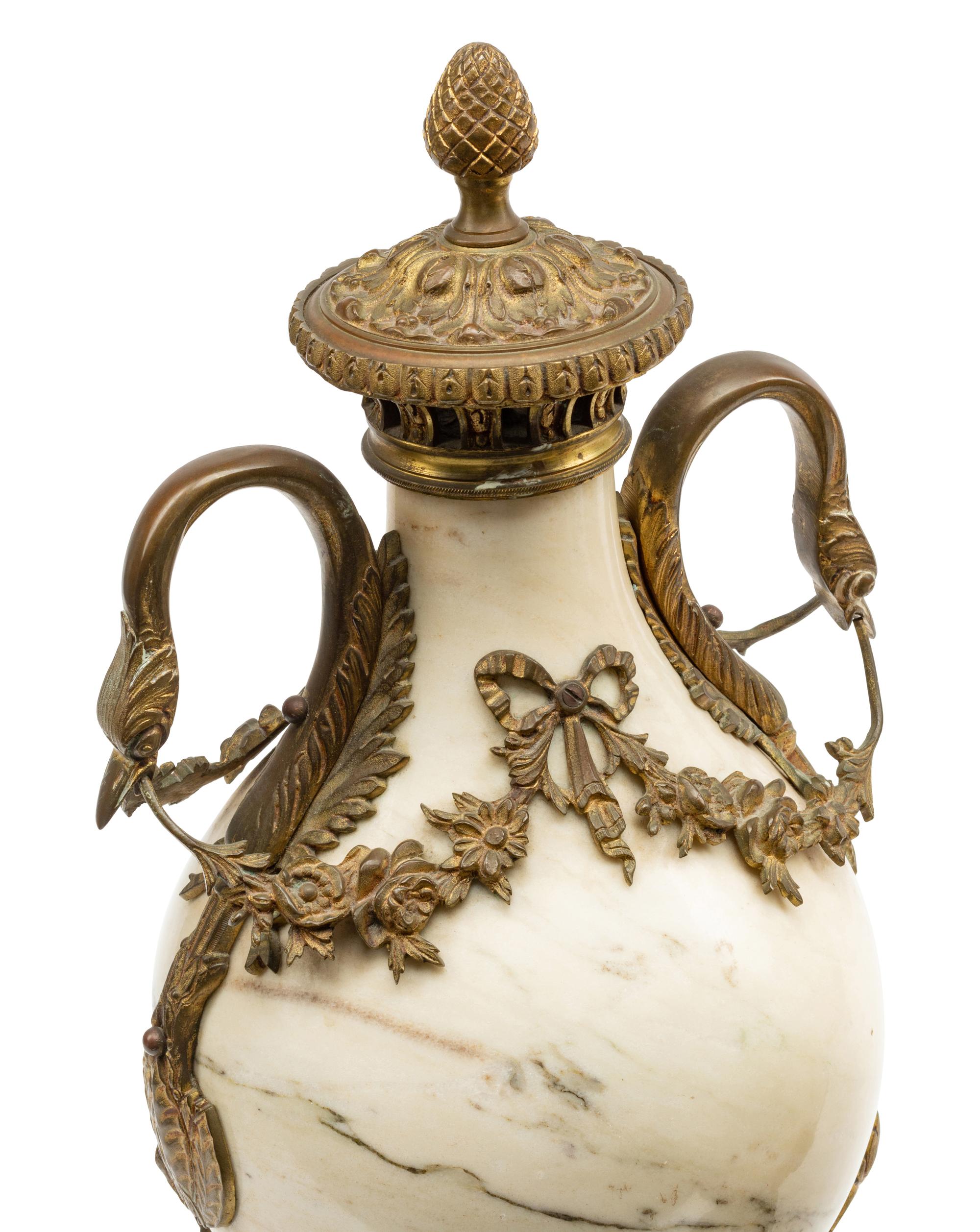 A Pair of Continental Gilt Bronze Mounted Marble Urns