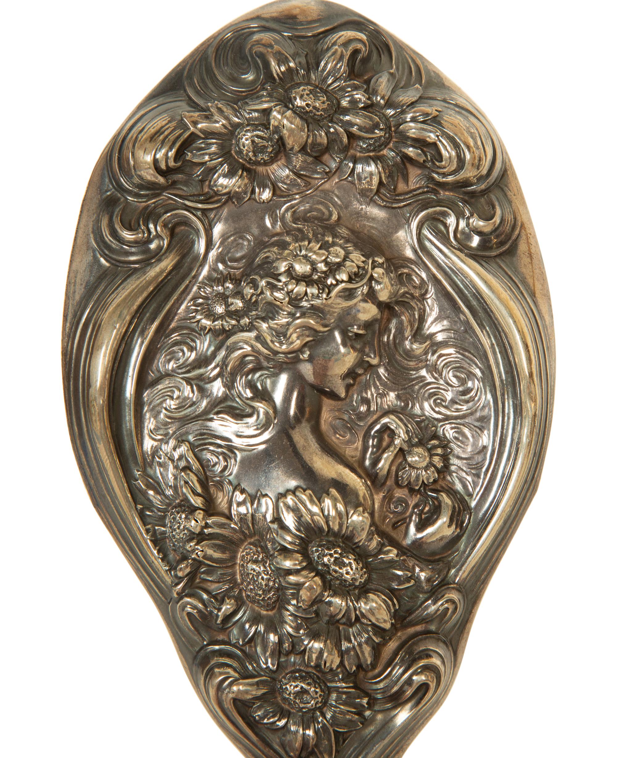 A Silver Hand Mirror and Hairbrush
