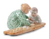 A Meissen Porcelain Figural Group of Children Playing in Sand