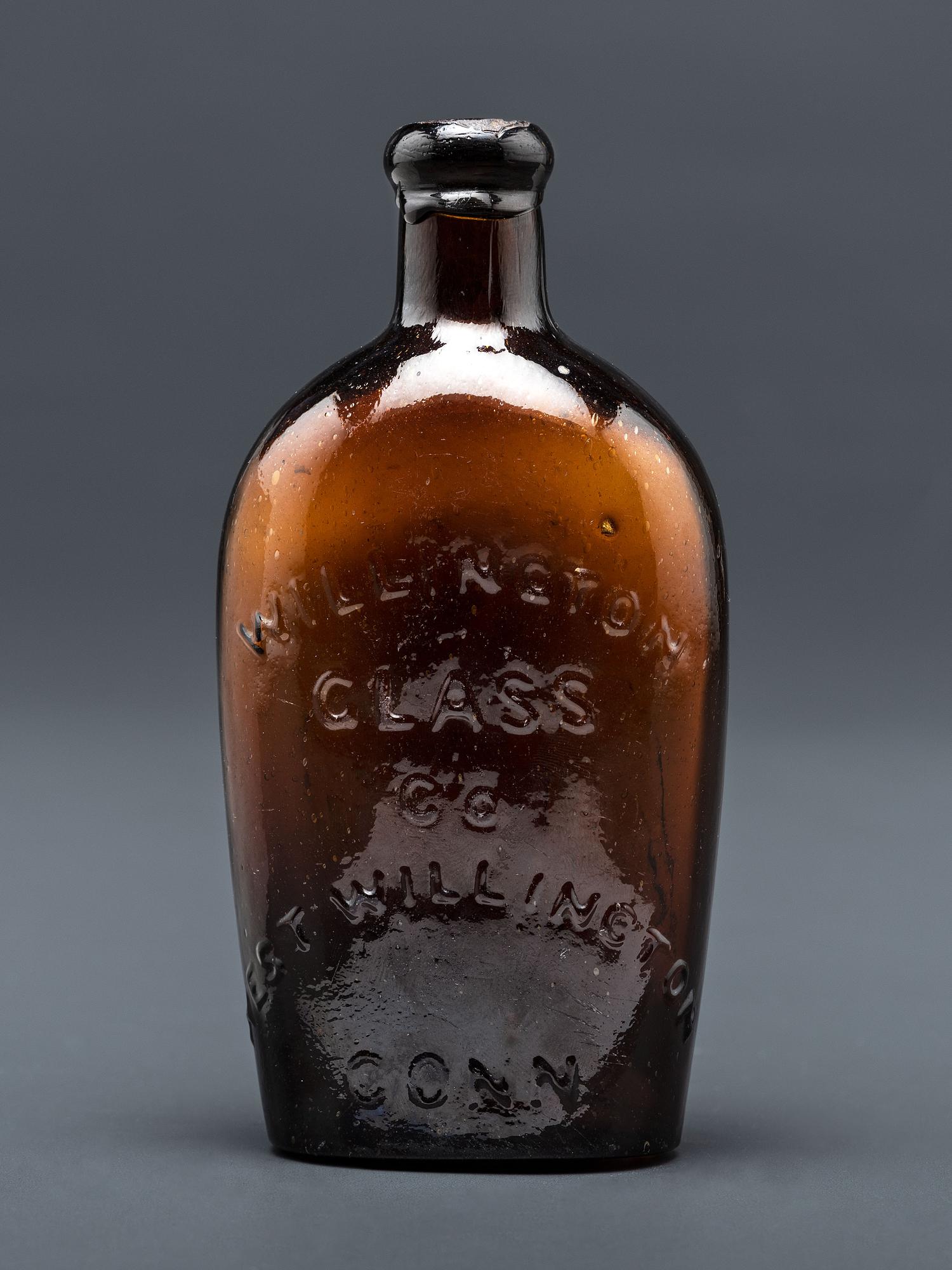 A Molded-Glass Flask in Amber by Willington Glass Company, Connecticut