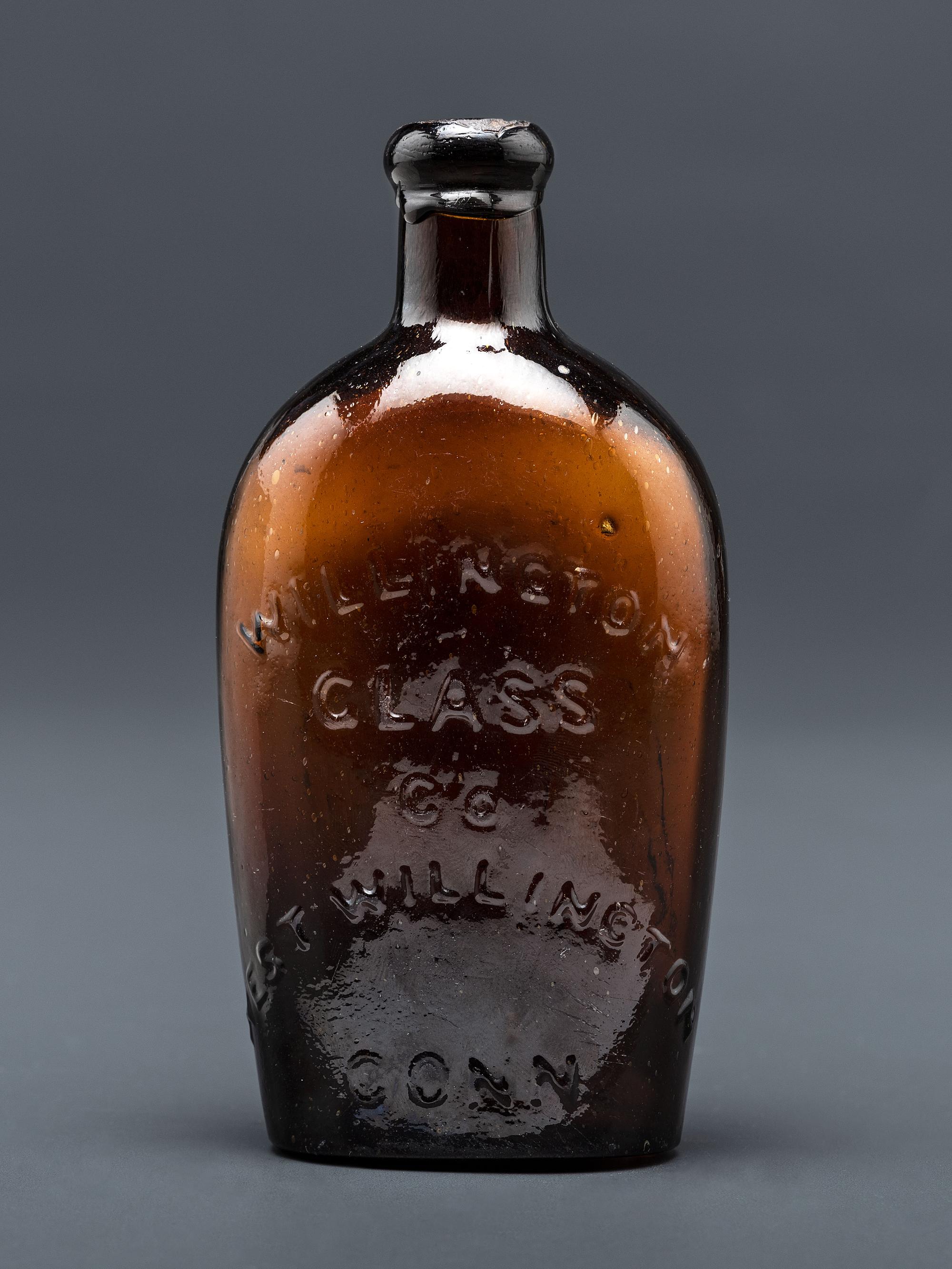 A Molded-Glass Flask in Amber by Willington Glass Company, Connecticut