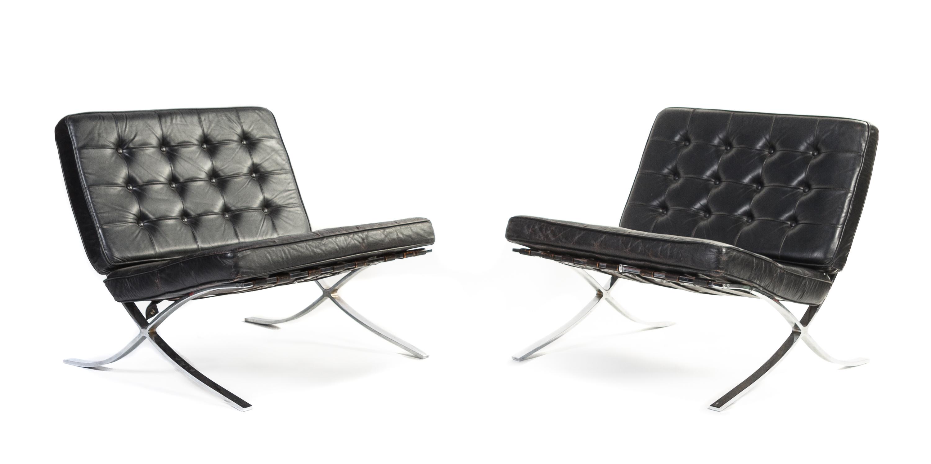 A Pair of Chrome and Leather Barcelona Chairs, after the design by Ludwig Mies Van der Rohe Height 28 1/2 x width 32 1/2 x depth 37 inc