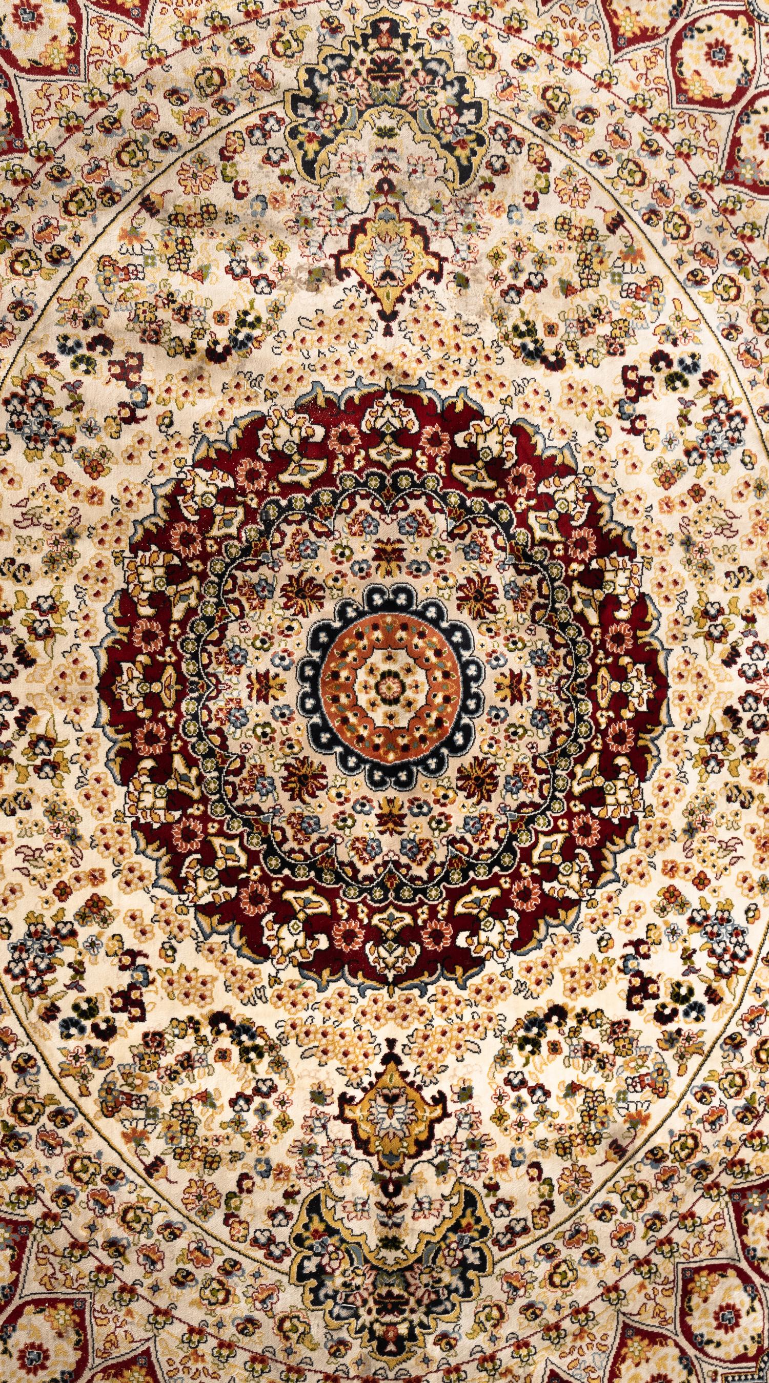 A Qom Wool and Silk Rug