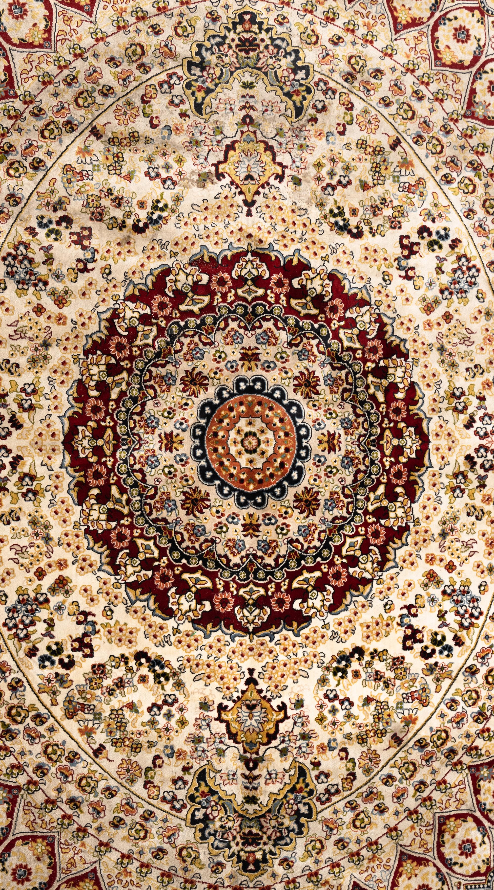 A Qom Wool and Silk Rug