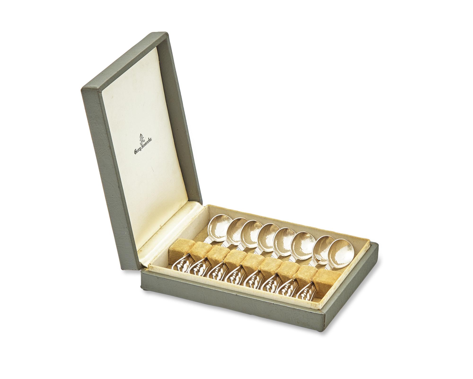 A Set of Eight Georg Jensen Silver Blossom Coffee Spoons